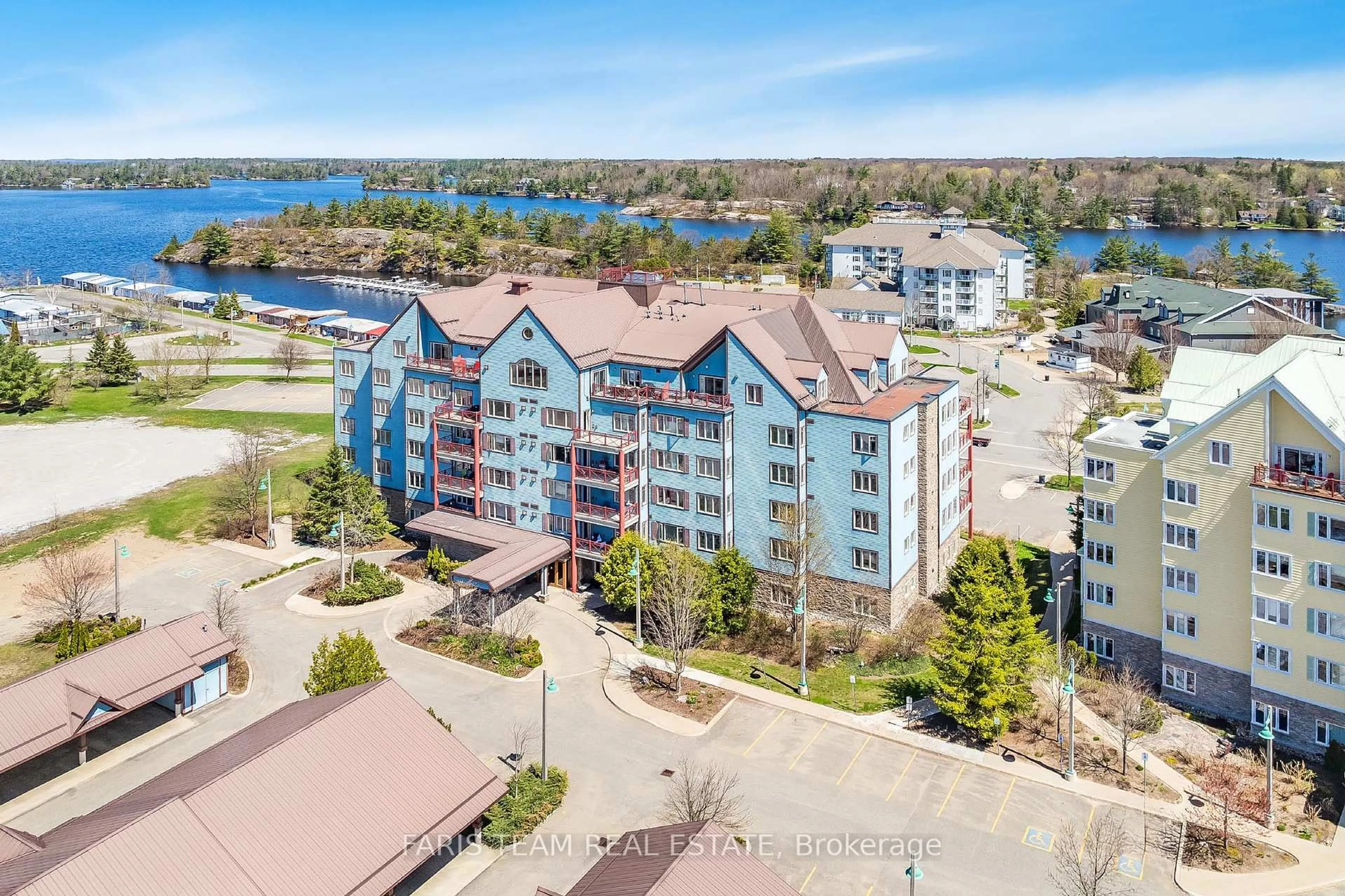 A pic from outside/outdoor area/front of a property/back of a property/a pic from drone, water/lake/river/ocean view for 130 Steamship Bay Rd #204, Gravenhurst Ontario P1P 1Z9