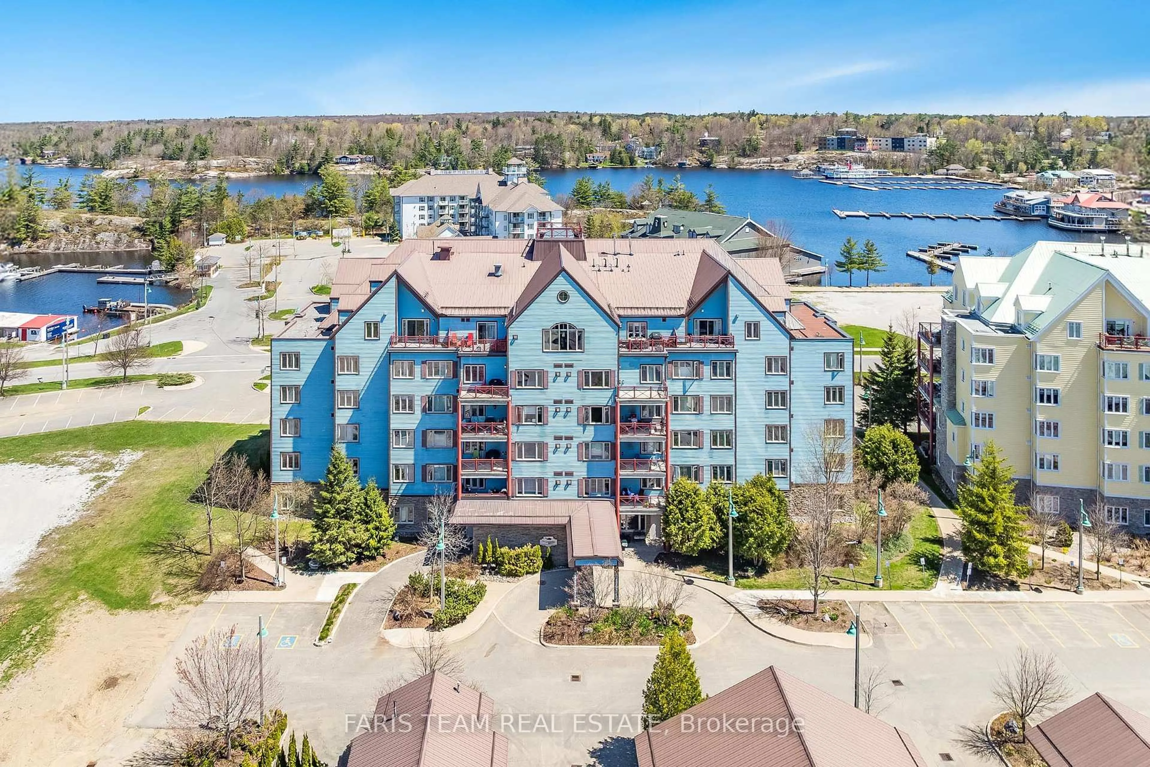 A pic from outside/outdoor area/front of a property/back of a property/a pic from drone, water/lake/river/ocean view for 130 Steamship Bay Rd #204, Gravenhurst Ontario P1P 1Z9