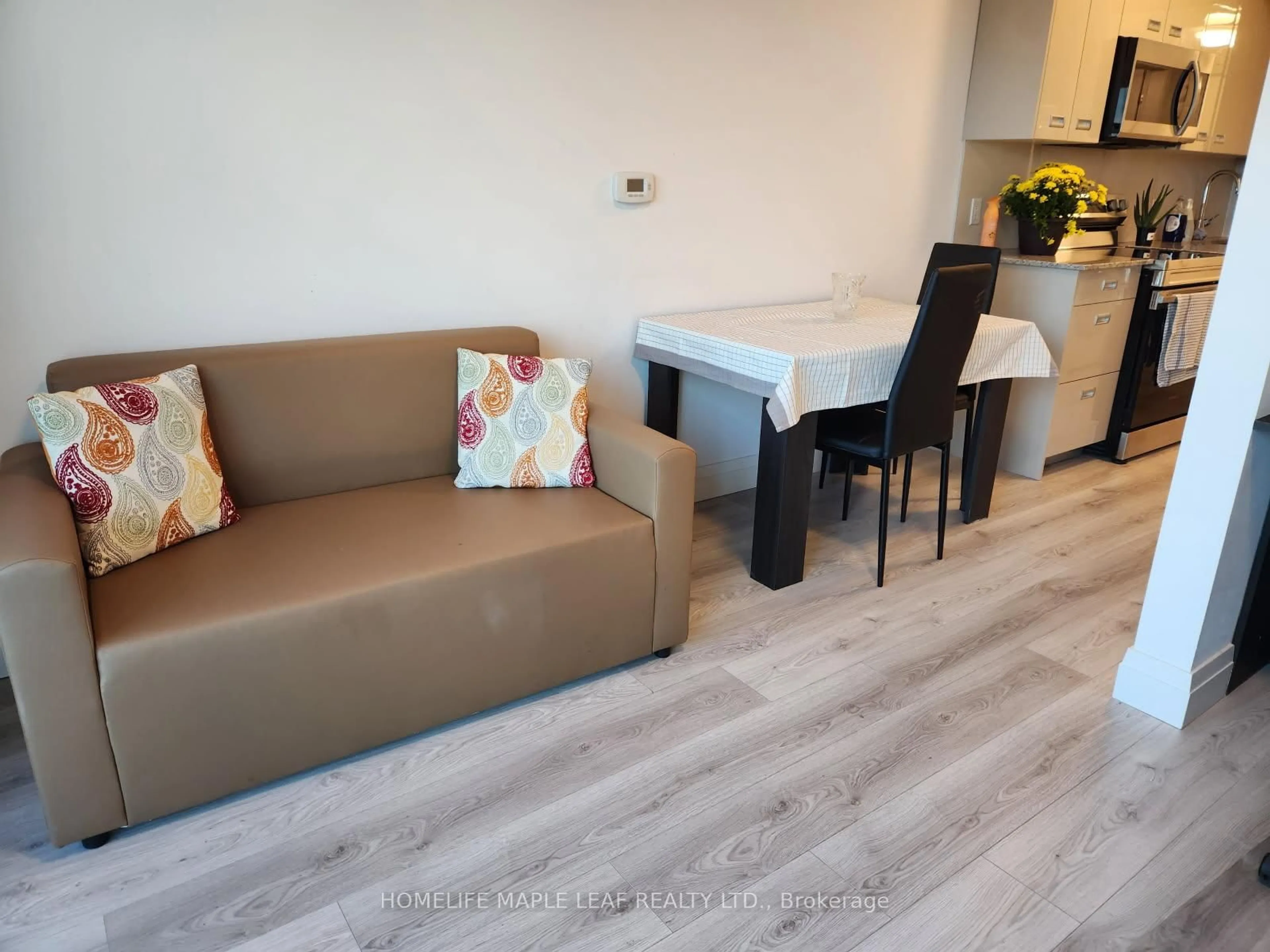 Living room with furniture, wood/laminate floor for 652 PRINCESS St #710, Kingston Ontario K7L 3Z9