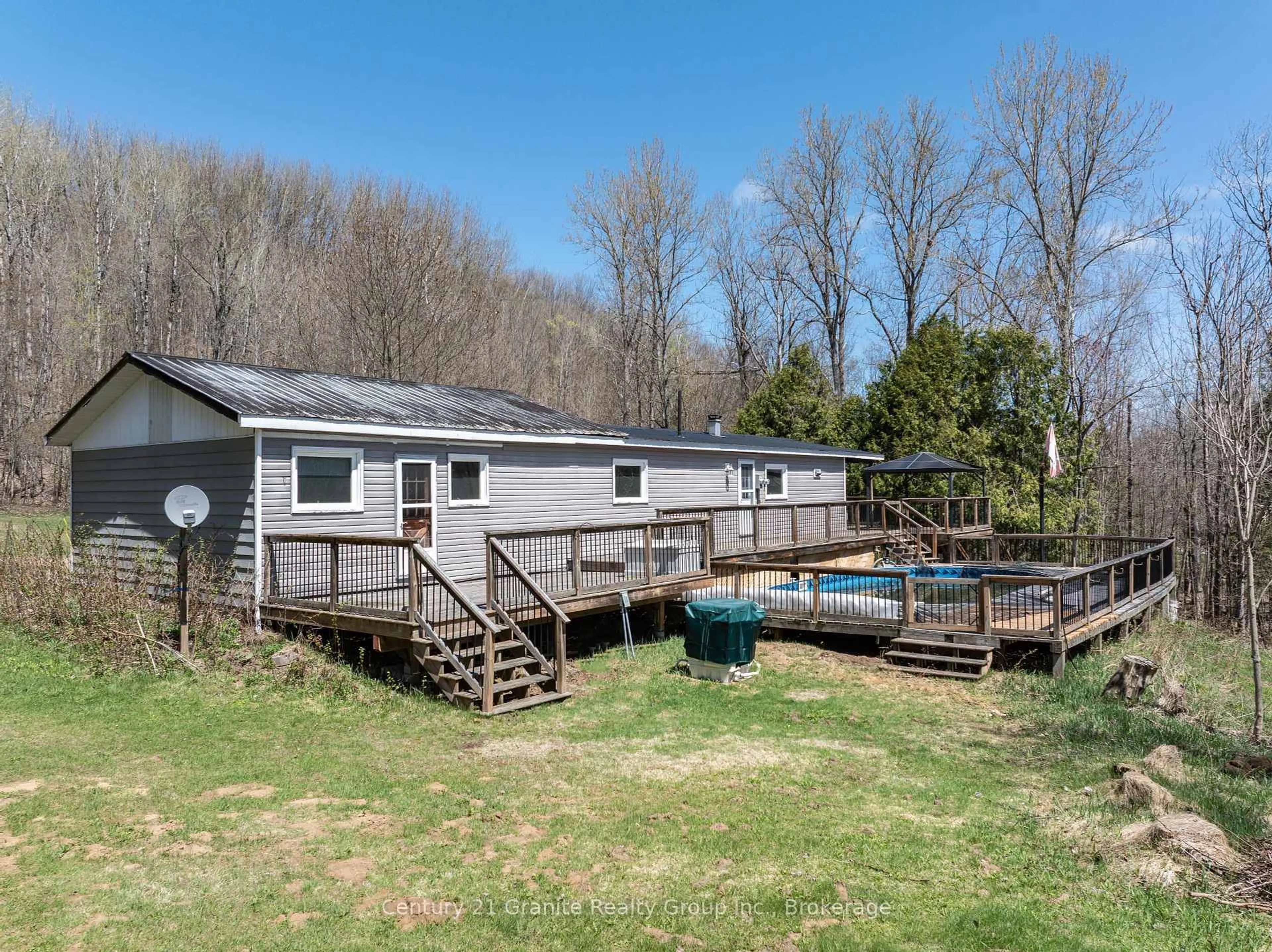 A pic from outside/outdoor area/front of a property/back of a property/a pic from drone, water/lake/river/ocean view for 6739 Gelert Rd, Dysart et al Ontario K0M 1S0