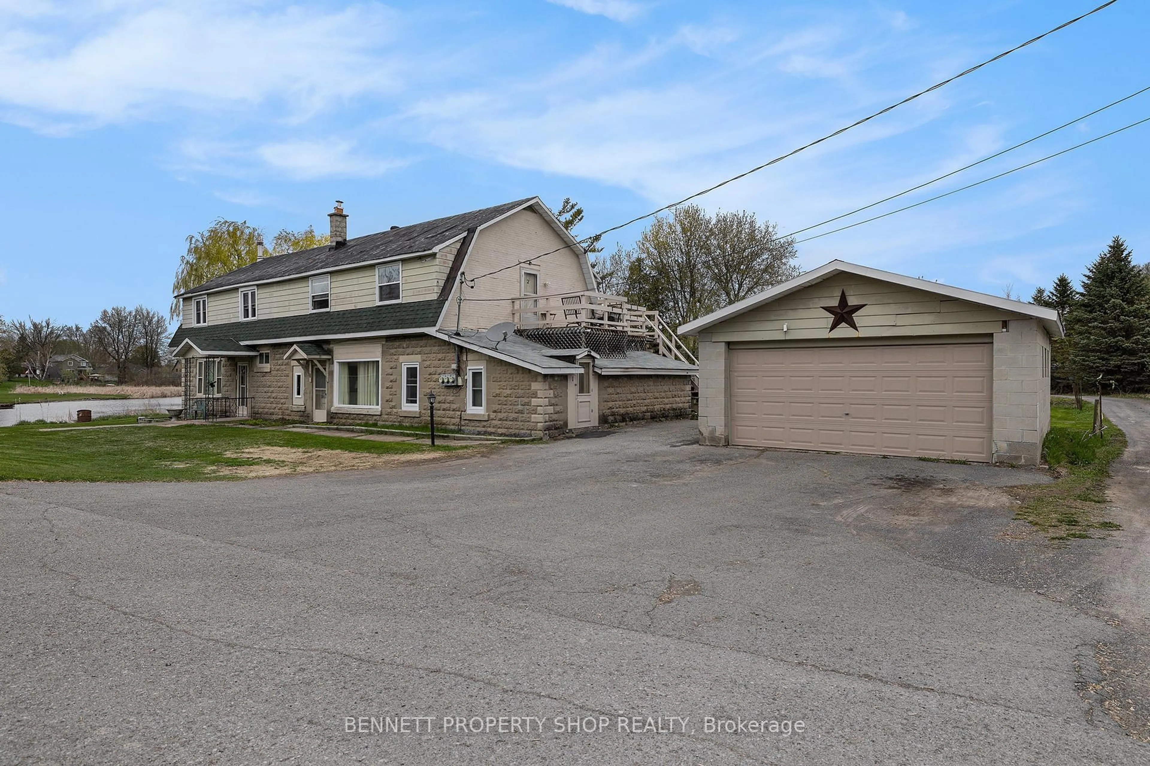 A pic from outside/outdoor area/front of a property/back of a property/a pic from drone, street for 6763 Rideau Valley Dr, Kars Ontario K0A 2E0