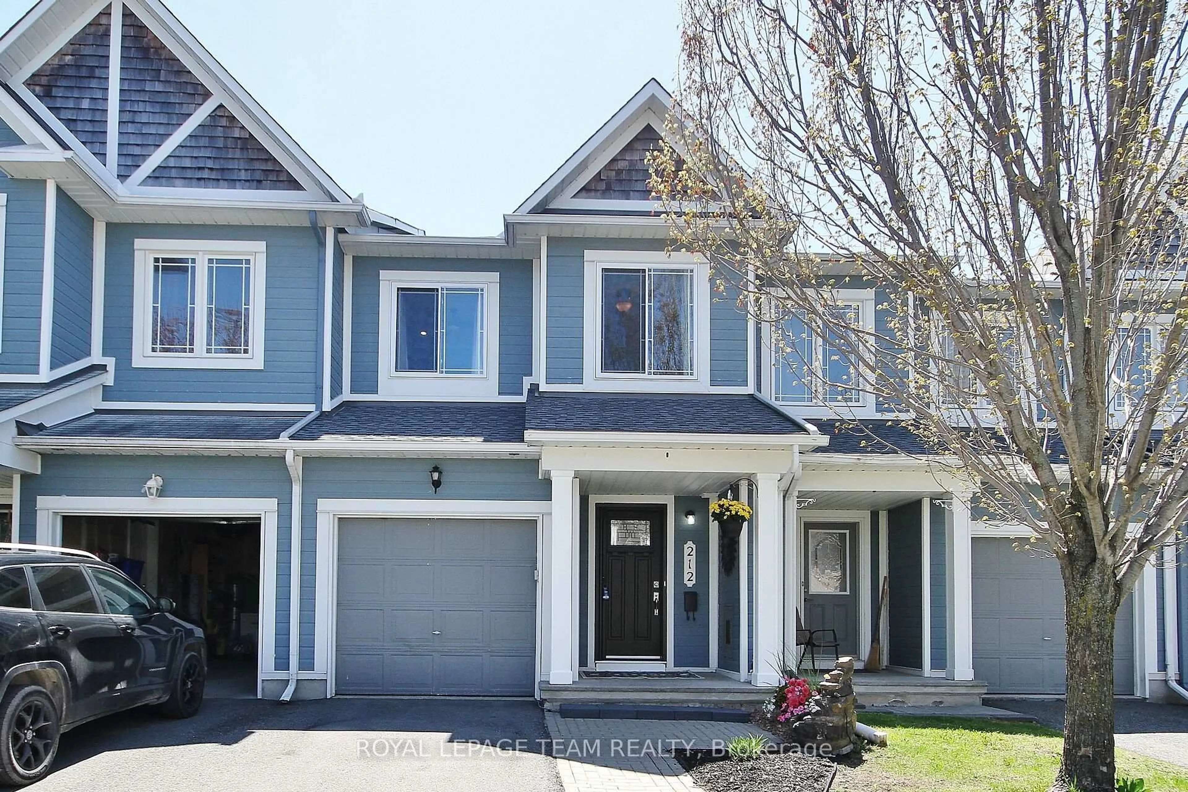 Home with vinyl exterior material, street for 212 Meadowbreeze Dr #129, Ottawa Ontario K2M 3A9