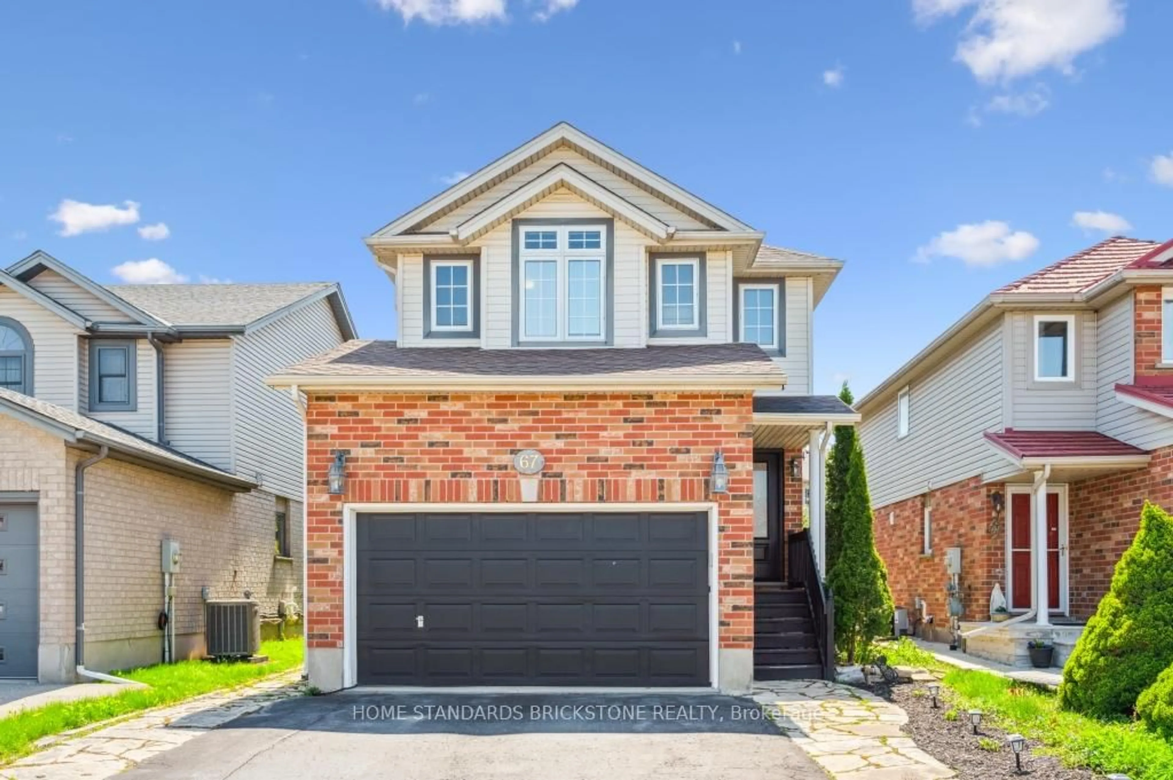 Home with brick exterior material, street for 67 Cotton Grass St, Kitchener Ontario N2E 3T7