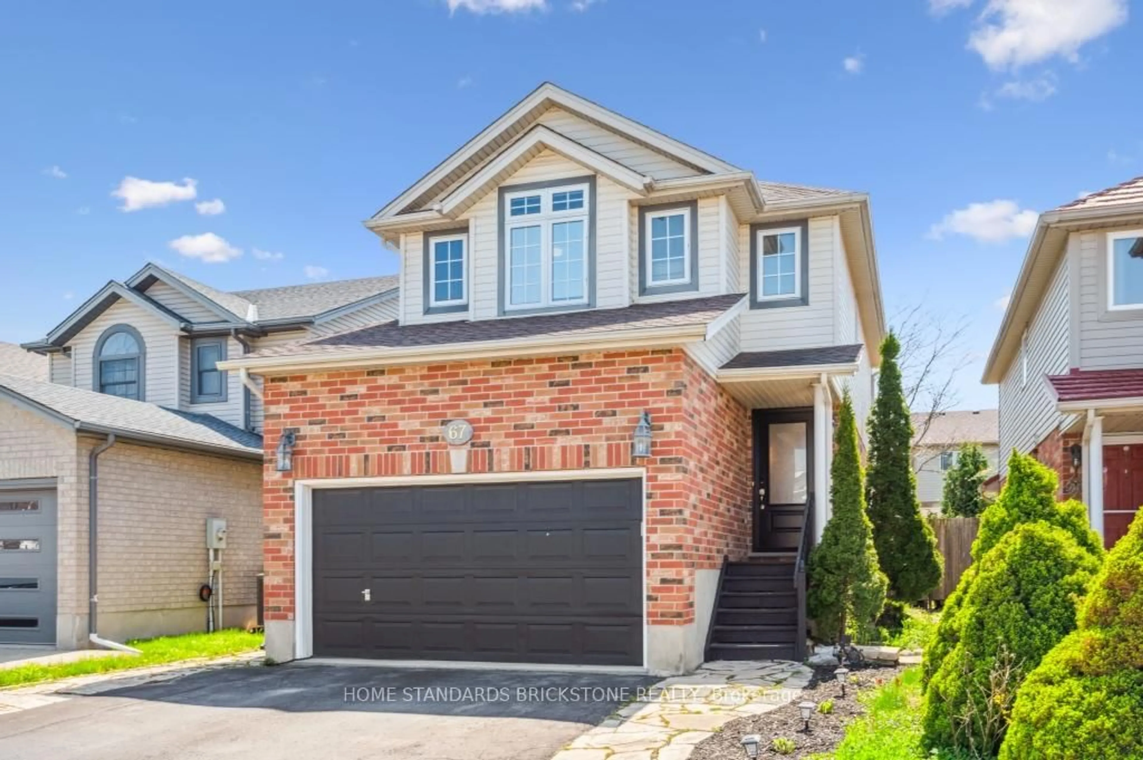 Home with brick exterior material, street for 67 Cotton Grass St, Kitchener Ontario N2E 3T7