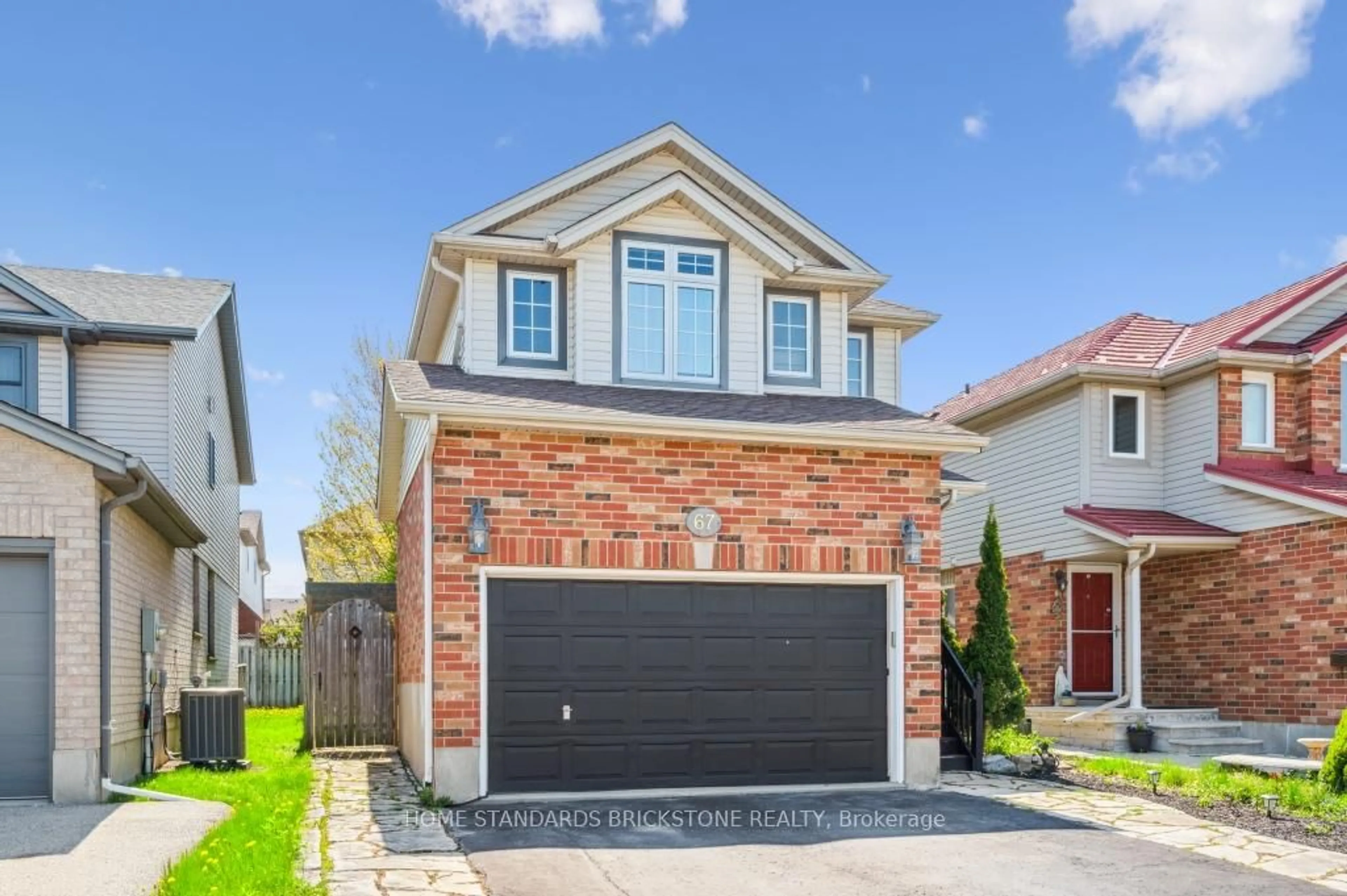 Home with brick exterior material, street for 67 Cotton Grass St, Kitchener Ontario N2E 3T7