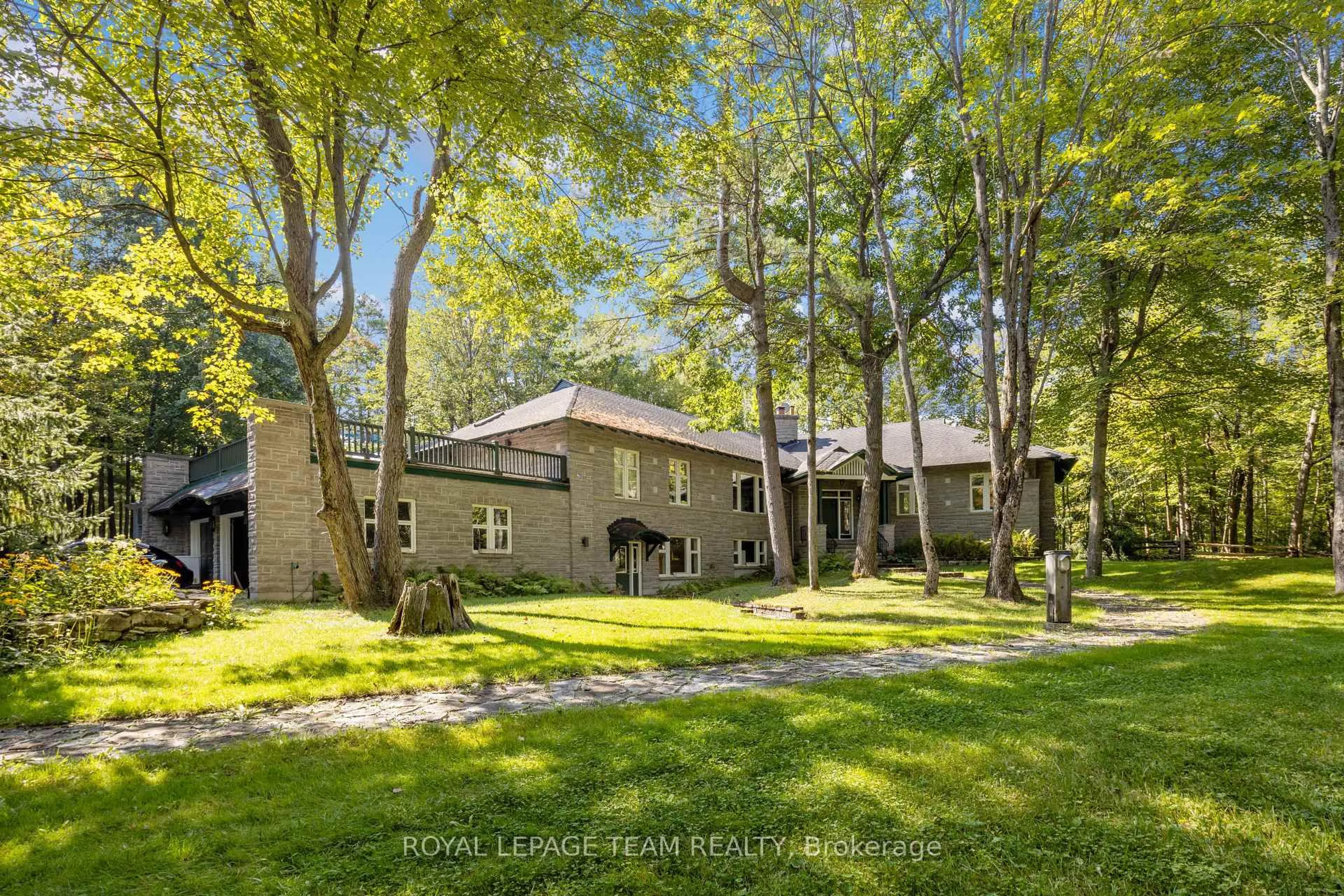 A pic from outside/outdoor area/front of a property/back of a property/a pic from drone, forest/trees view for 297 John Aselford Driveway Dr, Ottawa Ontario K2W 1A8