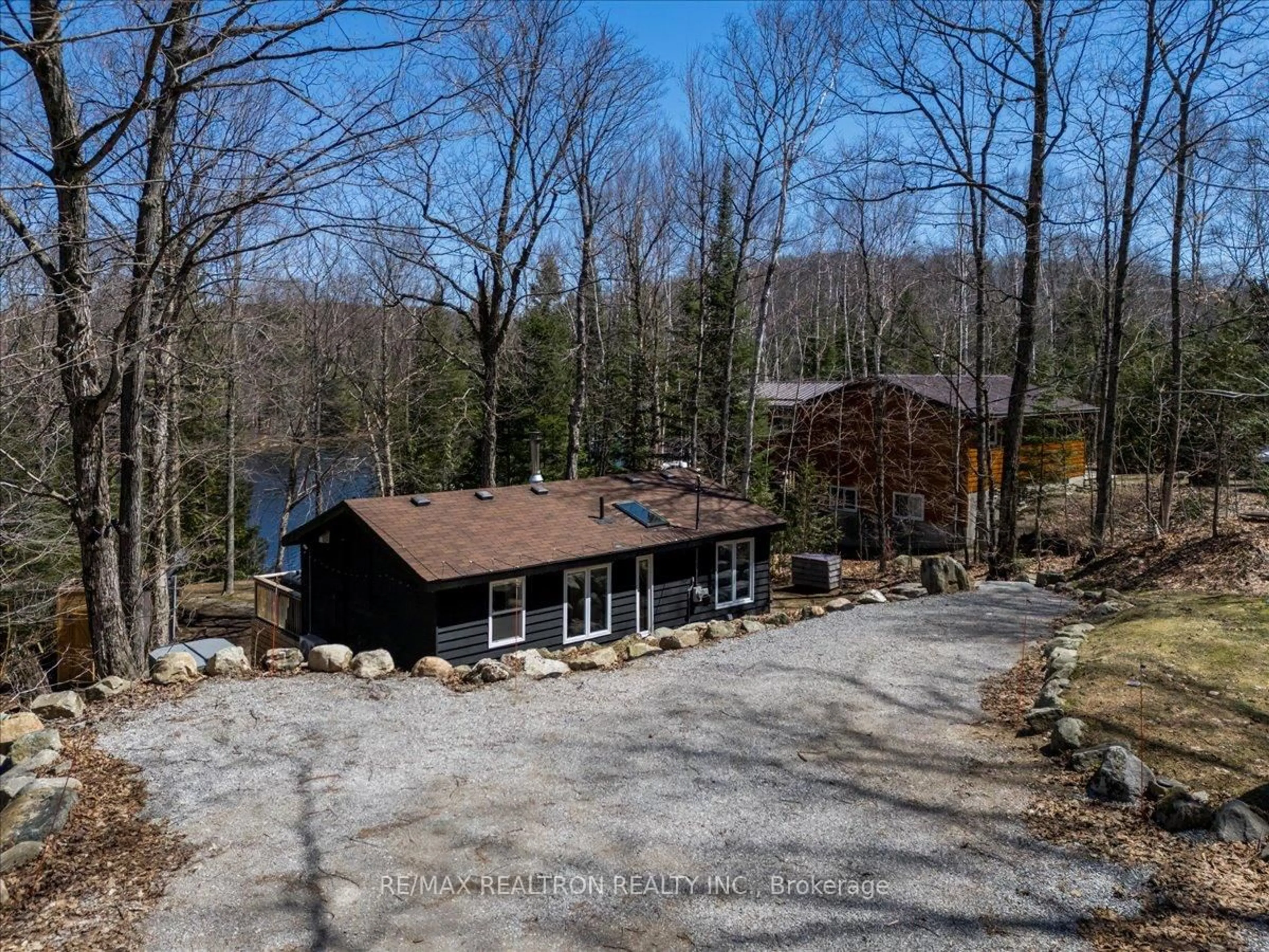 A pic from outside/outdoor area/front of a property/back of a property/a pic from drone, water/lake/river/ocean view for 1053 Esson Creek Lane, Highlands East Ontario K0L 3C0