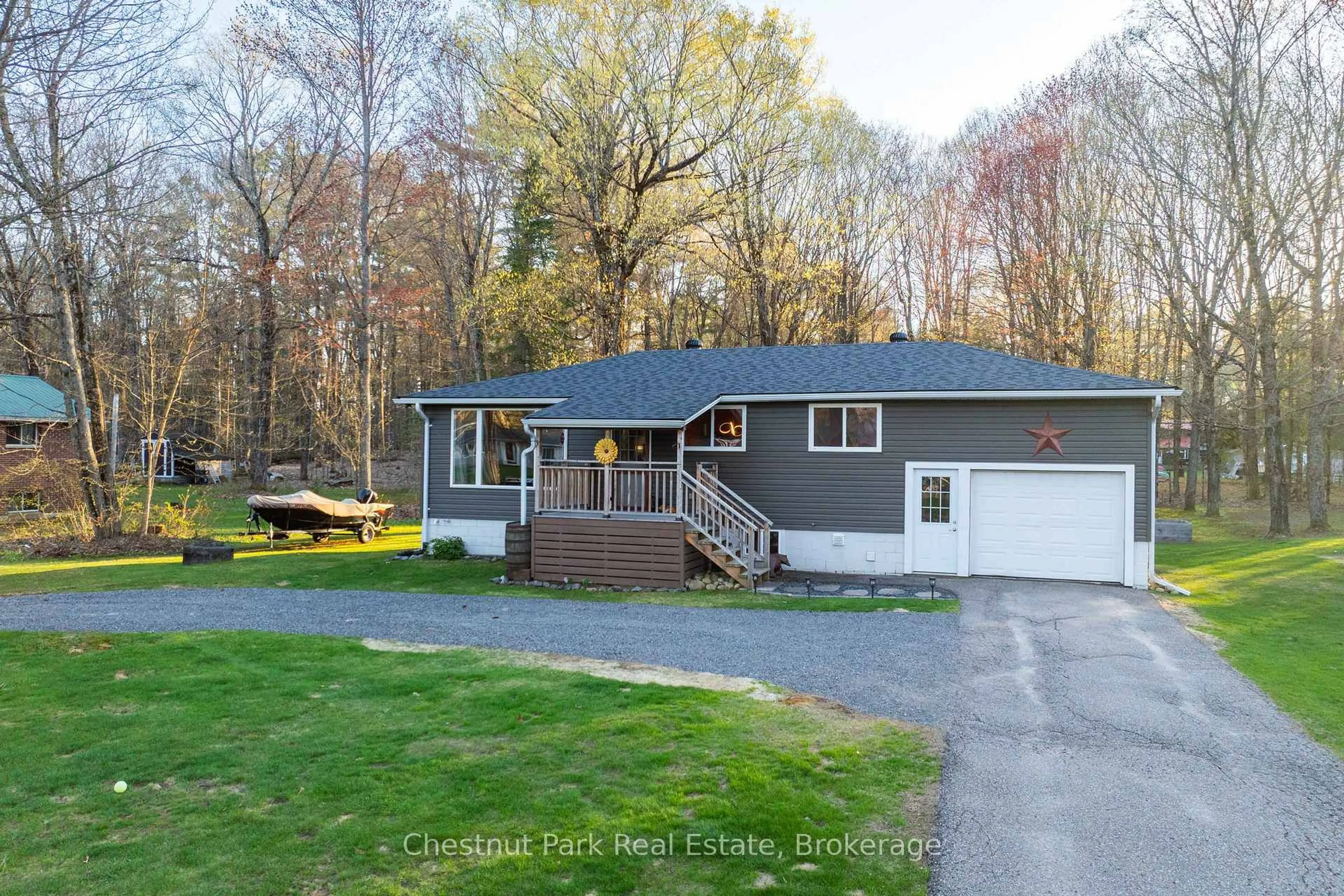 Home with vinyl exterior material, street for 104 Bridgedale Rd, Huntsville Ontario P0B 1L0