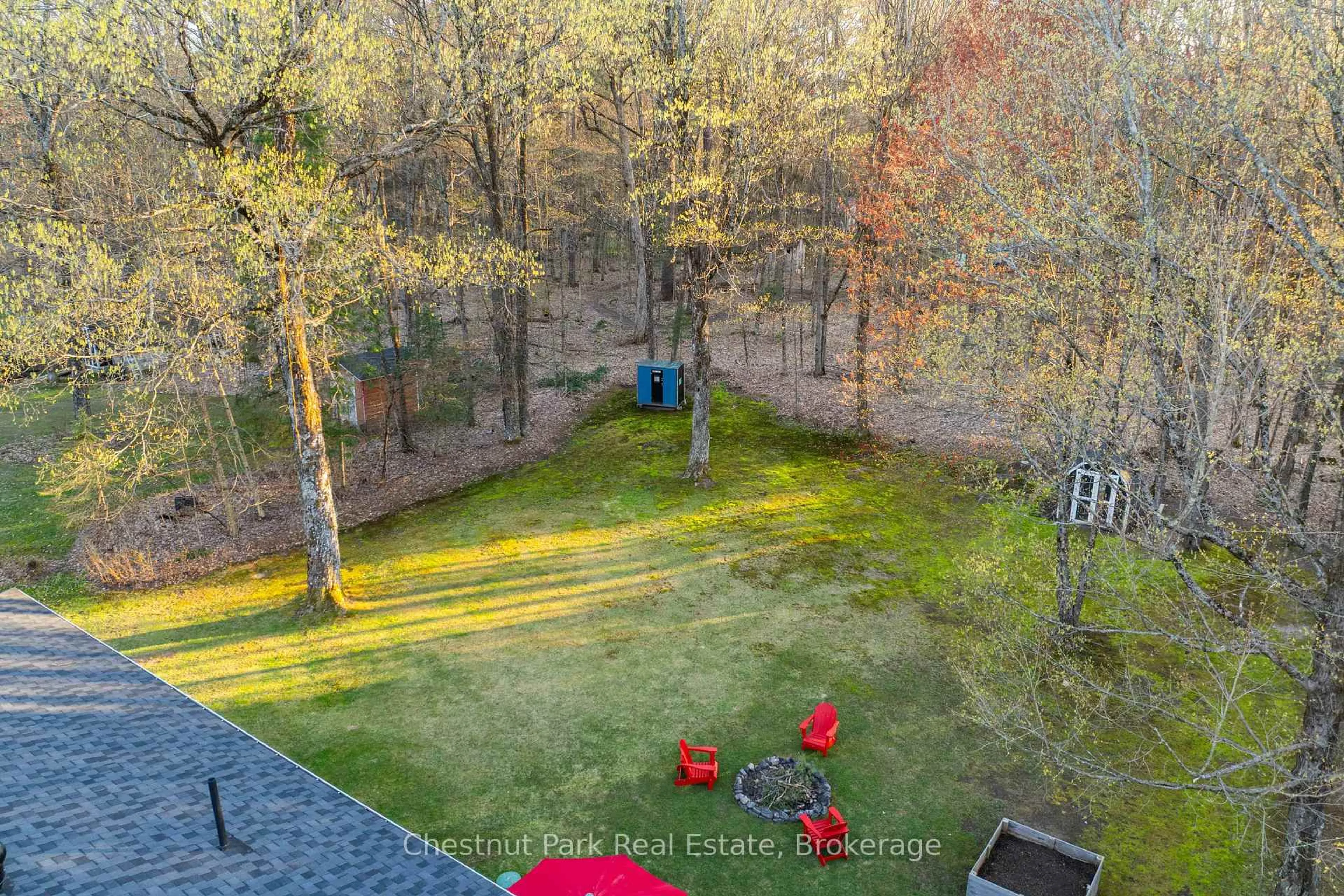 A pic from outside/outdoor area/front of a property/back of a property/a pic from drone, forest/trees view for 104 Bridgedale Rd, Huntsville Ontario P0B 1L0