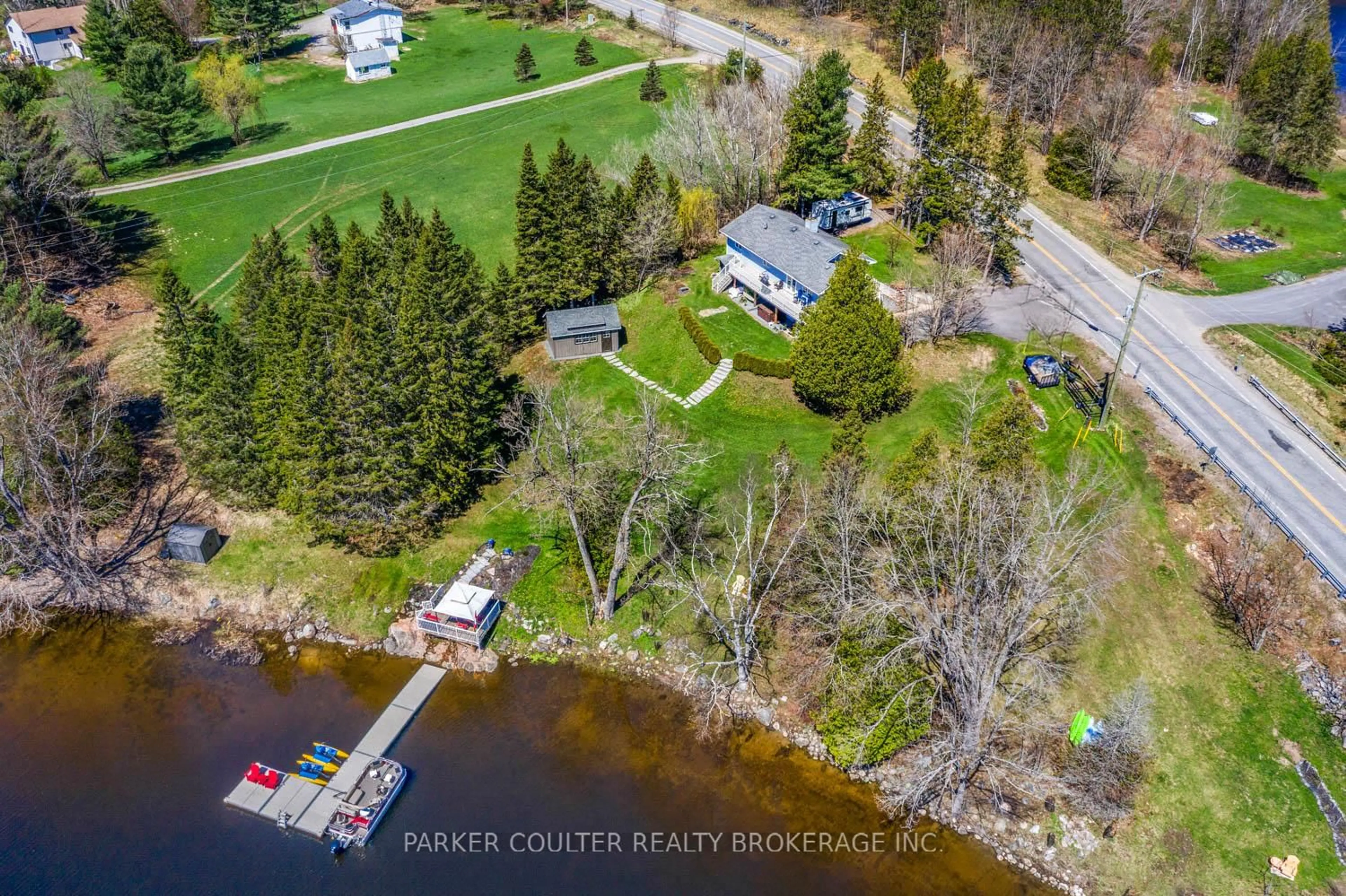 A pic from outside/outdoor area/front of a property/back of a property/a pic from drone, water/lake/river/ocean view for 1091 Hwy 518 N/A, Seguin Ontario P2A 2W9