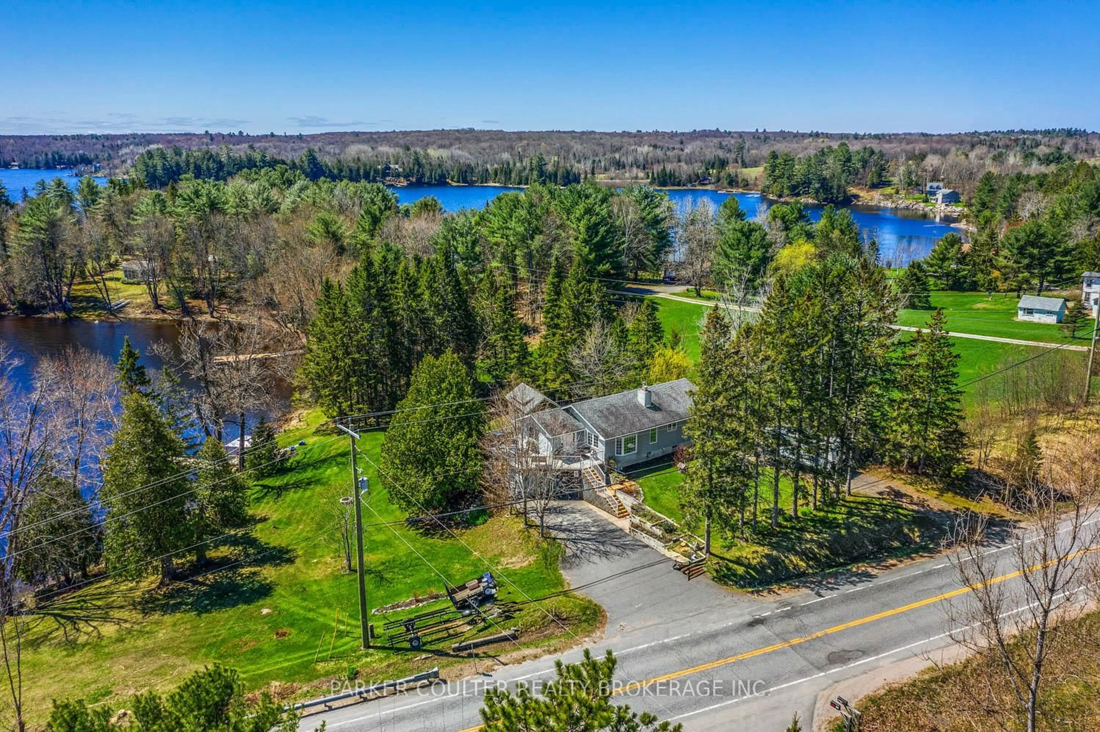 A pic from outside/outdoor area/front of a property/back of a property/a pic from drone, water/lake/river/ocean view for 1091 Hwy 518 N/A, Seguin Ontario P2A 2W9