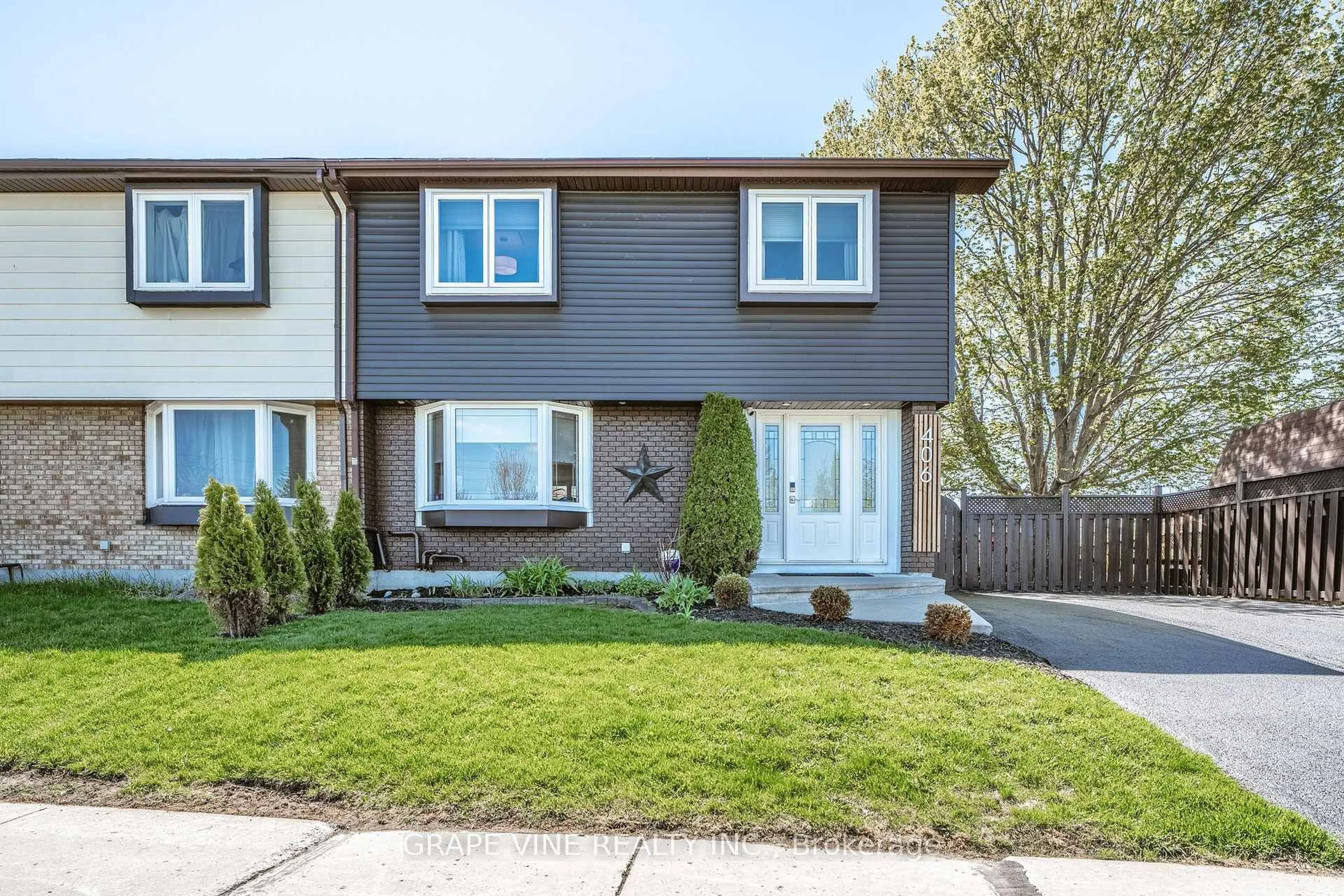 Home with vinyl exterior material, street for 406 Woodfield Dr, Ottawa Ontario K2G 3W9