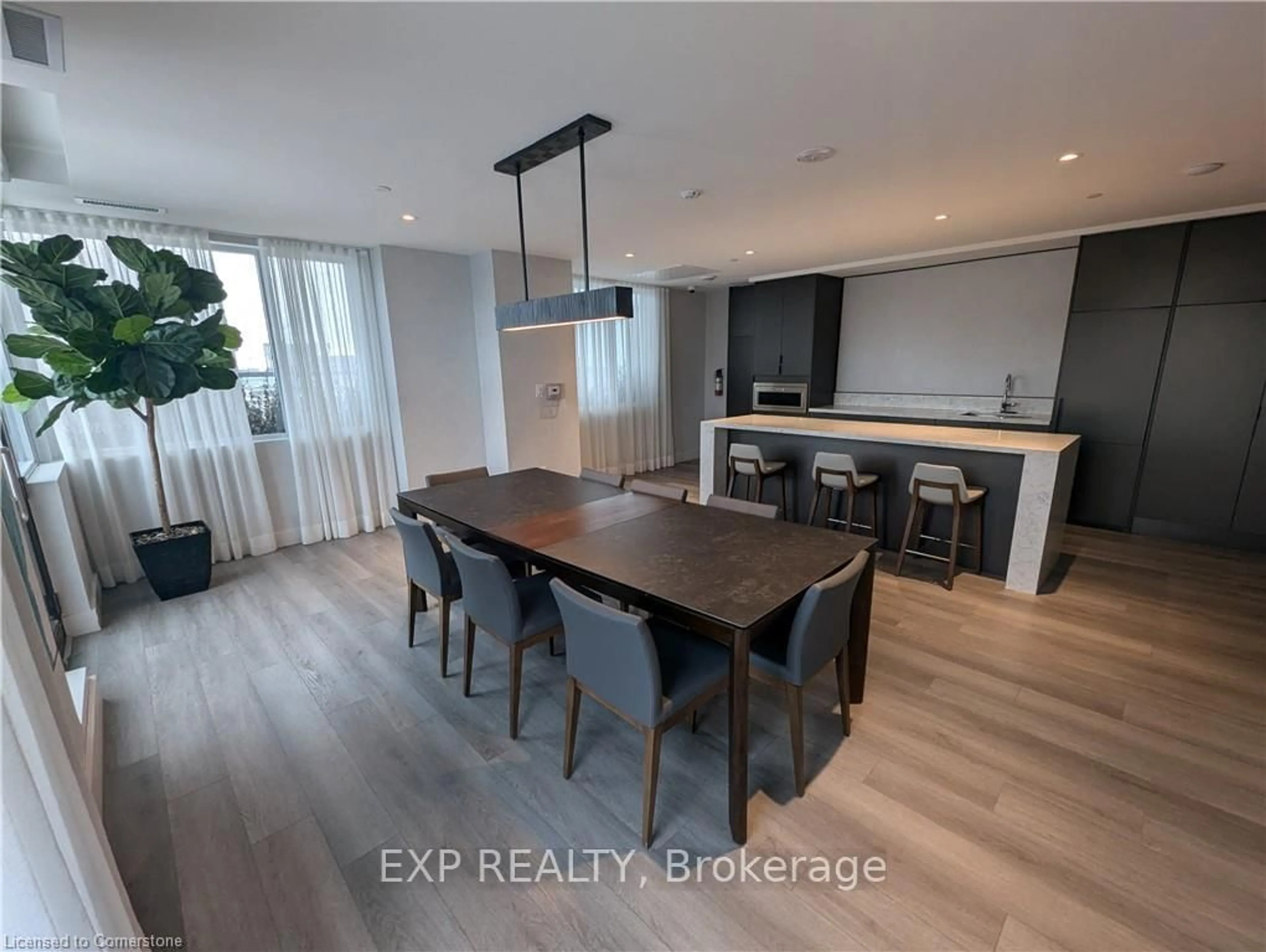Open concept kitchen, wood/laminate floor for 55 DUKE St #906, Kitchener Ontario N2H 0C9