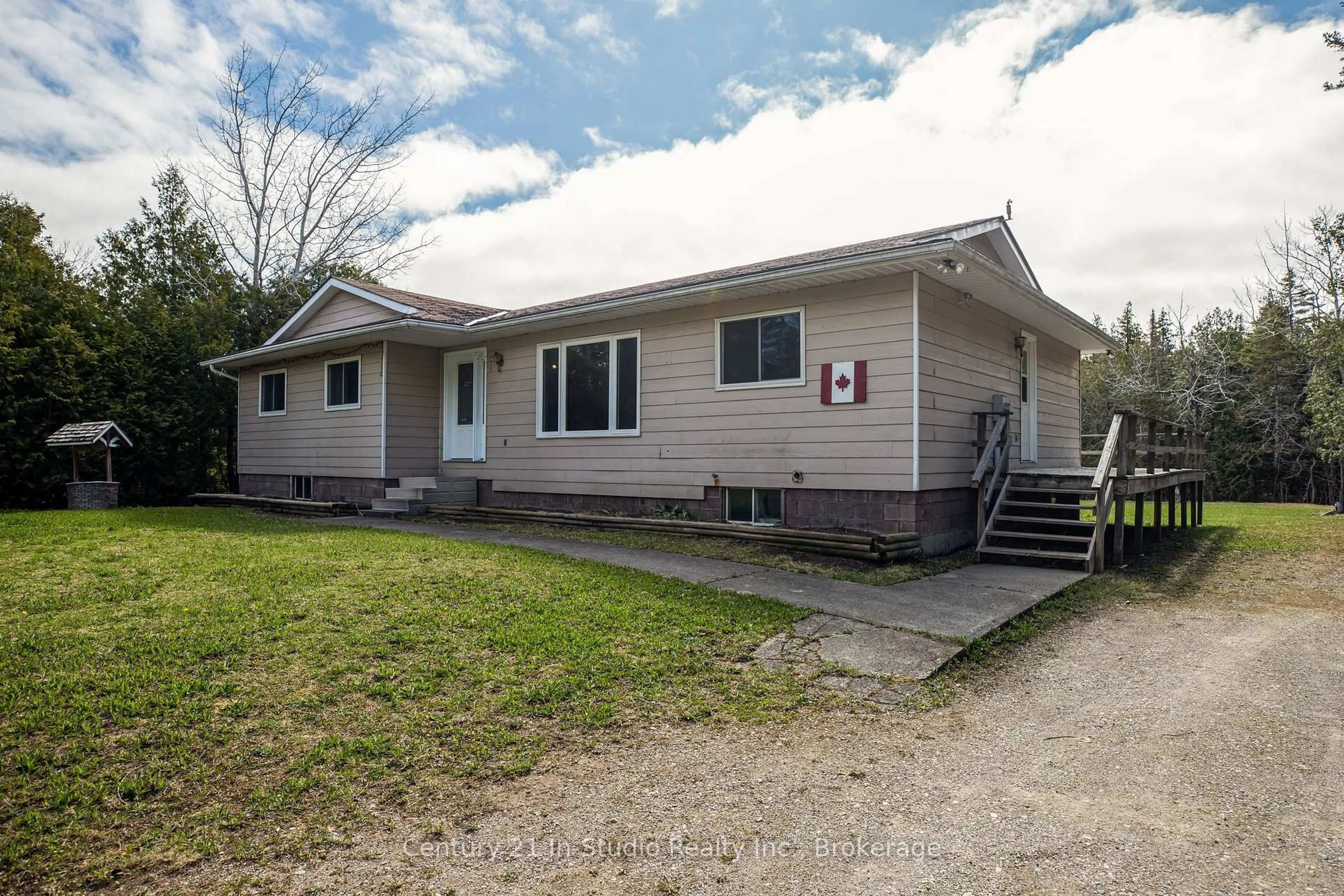 Home with vinyl exterior material, street for 12 Nicholas St, Northern Bruce Peninsula Ontario N0G 2R0