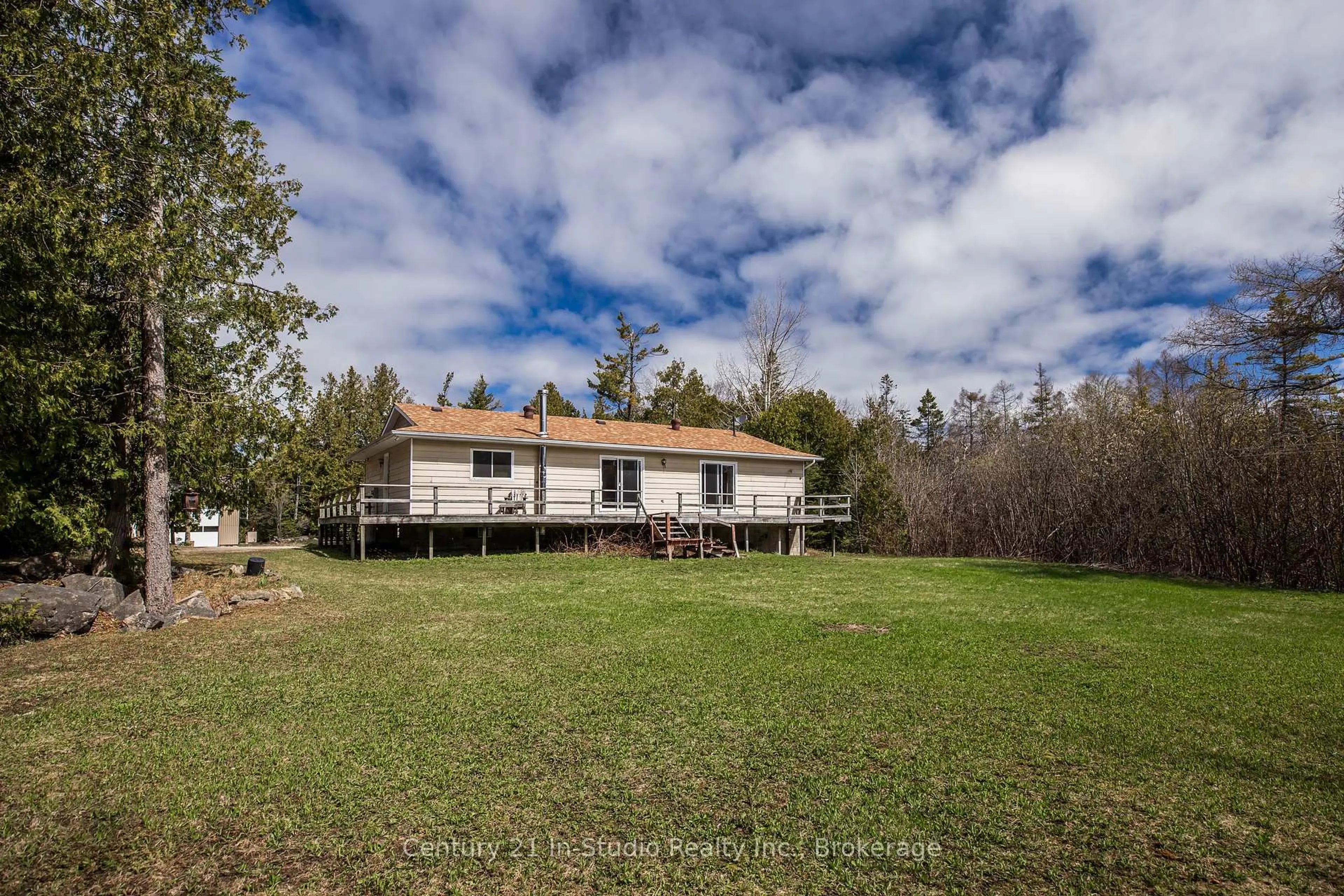 A pic from outside/outdoor area/front of a property/back of a property/a pic from drone, unknown for 12 Nicholas St, Northern Bruce Peninsula Ontario N0G 2R0