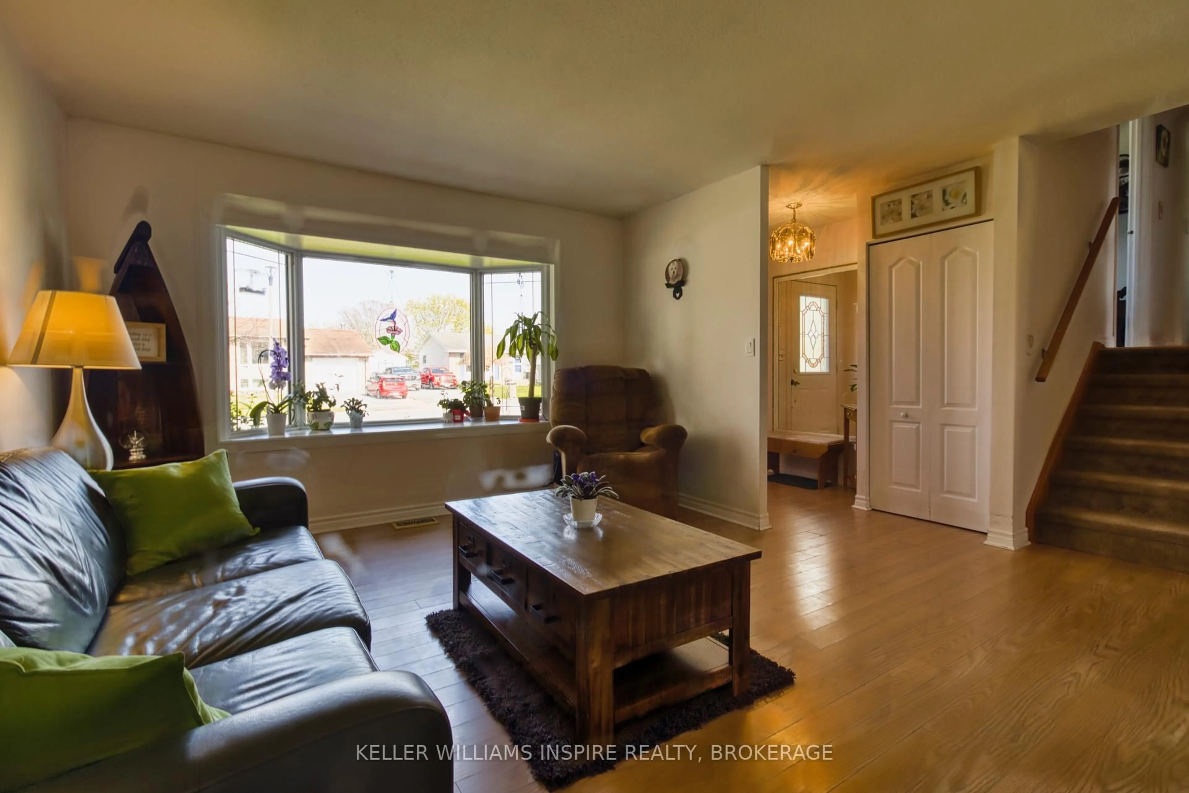 Living room with furniture, wood/laminate floor for 777 Clark Cres, Kingston Ontario K7M 6E7