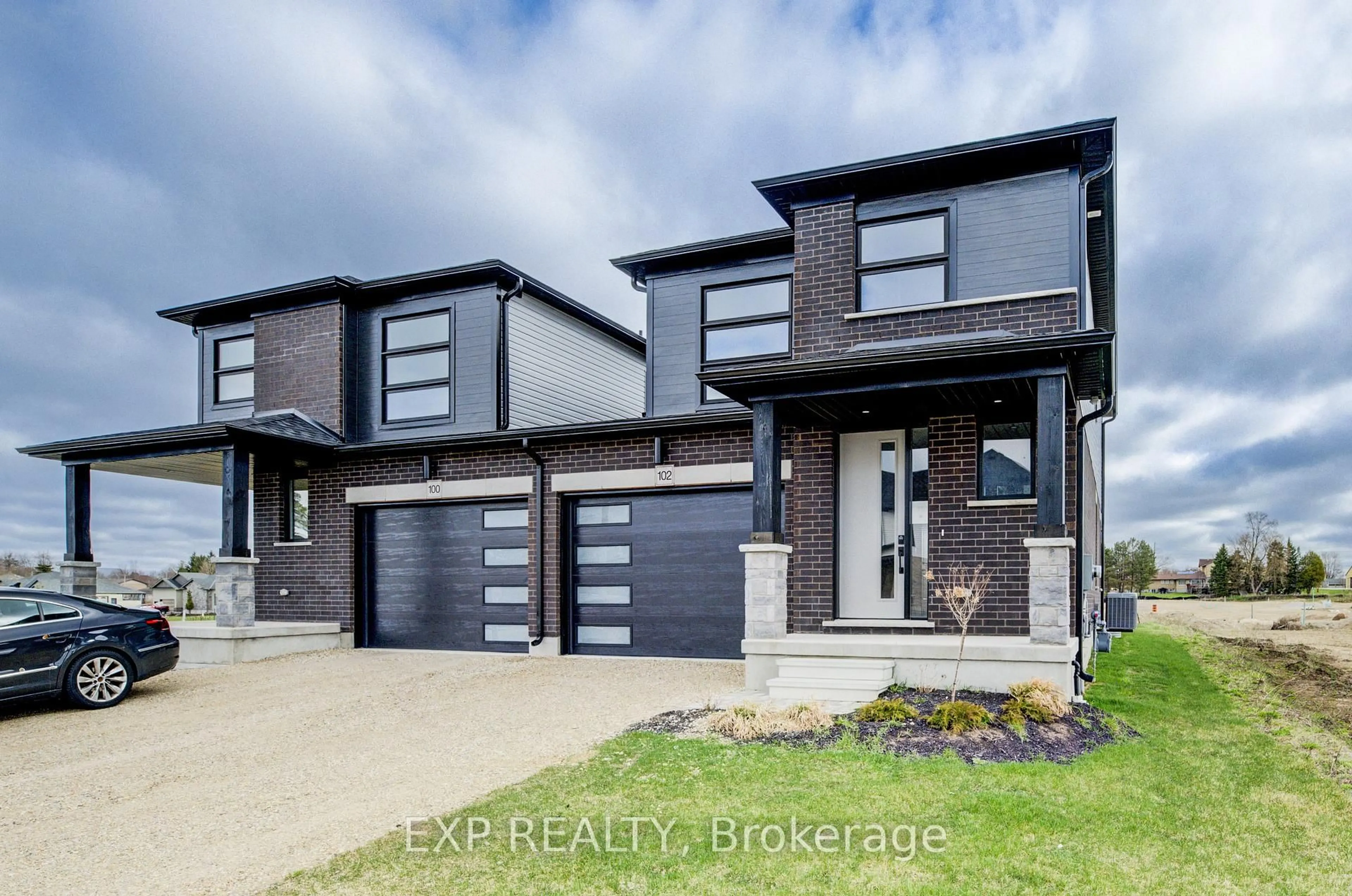 Home with brick exterior material, street for 102 Thackeray Way, Minto Ontario N0G 1Z0