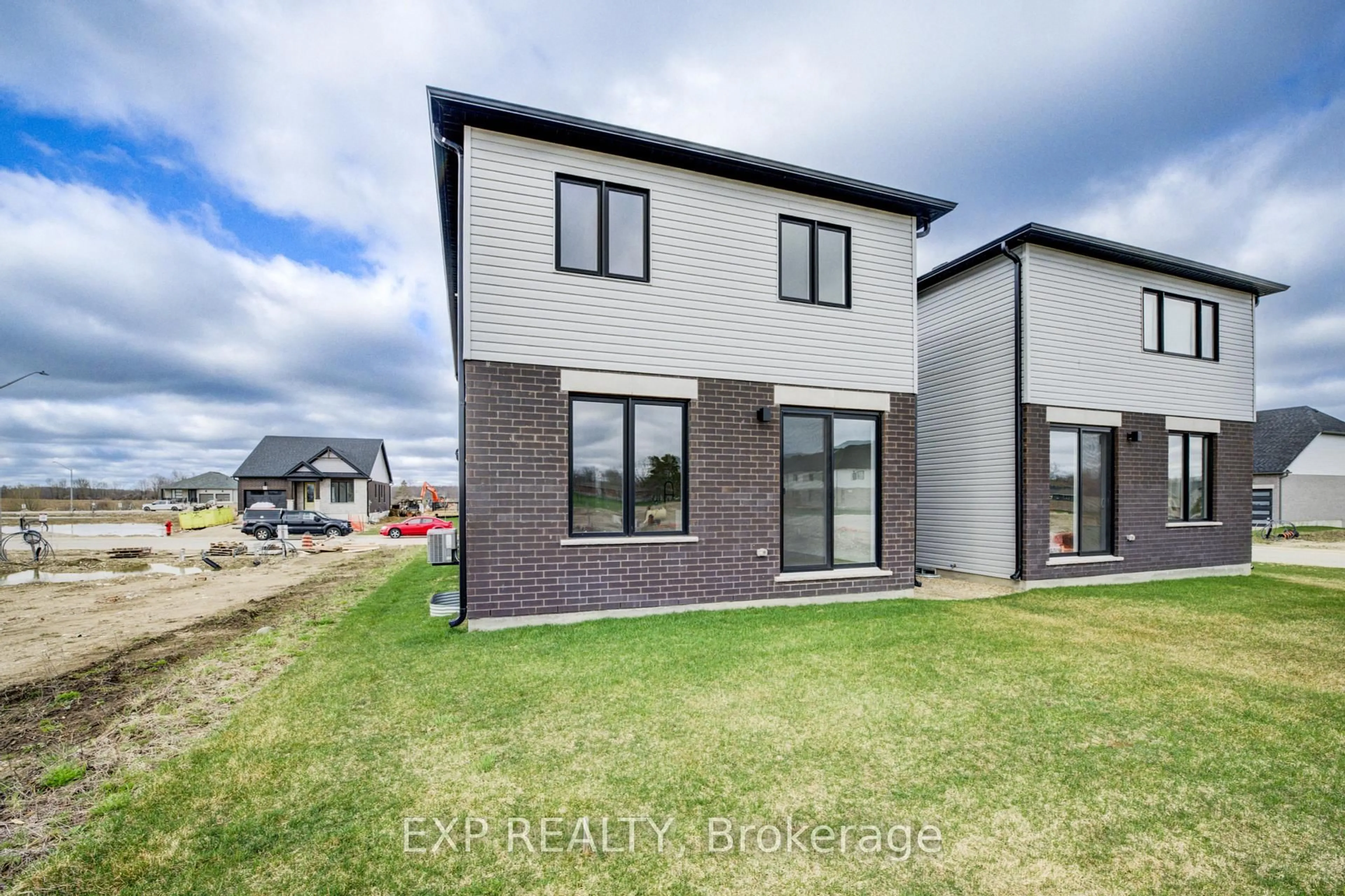 Home with brick exterior material, street for 102 Thackeray Way, Minto Ontario N0G 1Z0