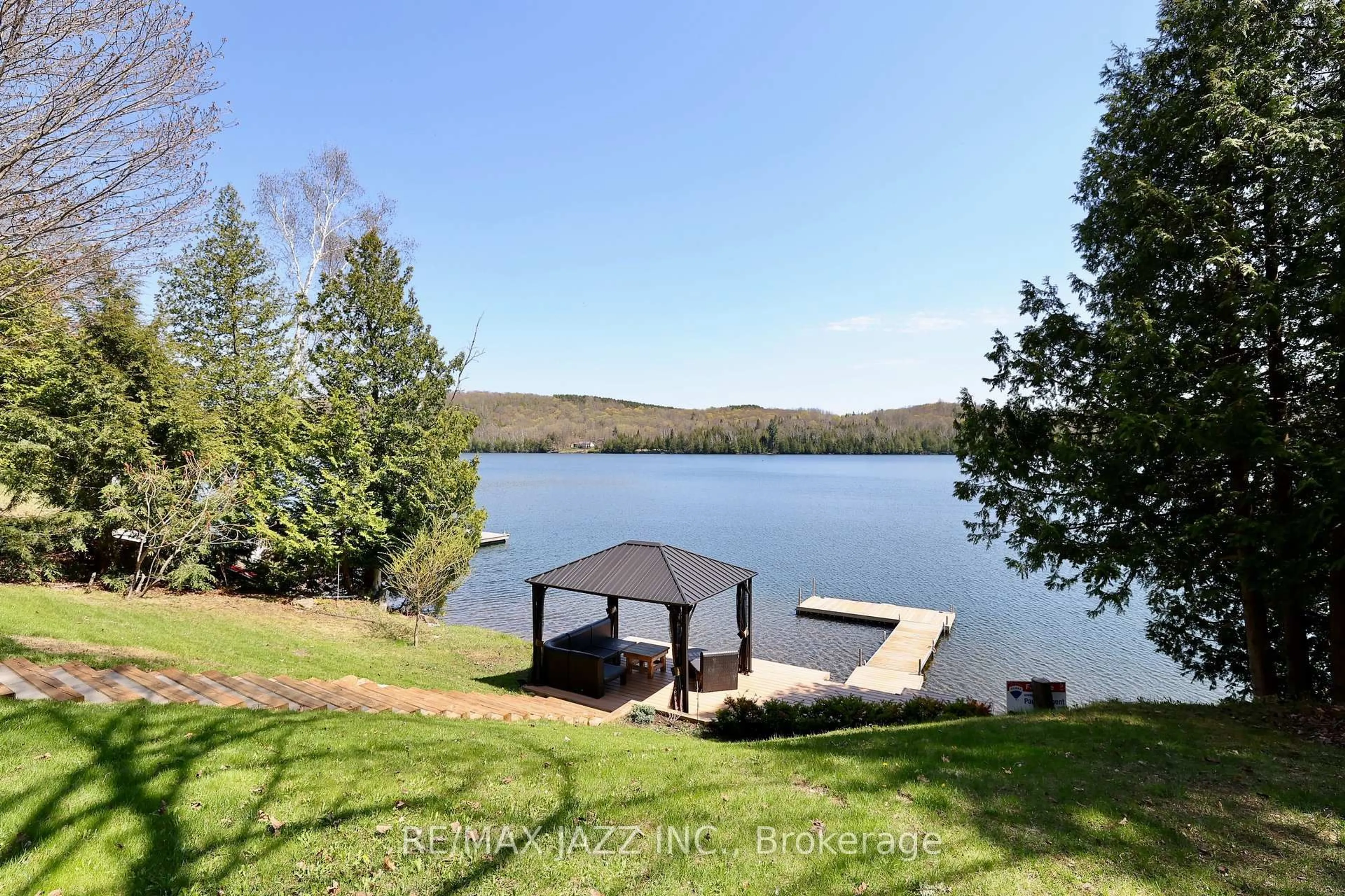 A pic from outside/outdoor area/front of a property/back of a property/a pic from drone, water/lake/river/ocean view for 8 Willys Lane, Palmer Rapids Ontario K0J 2E0