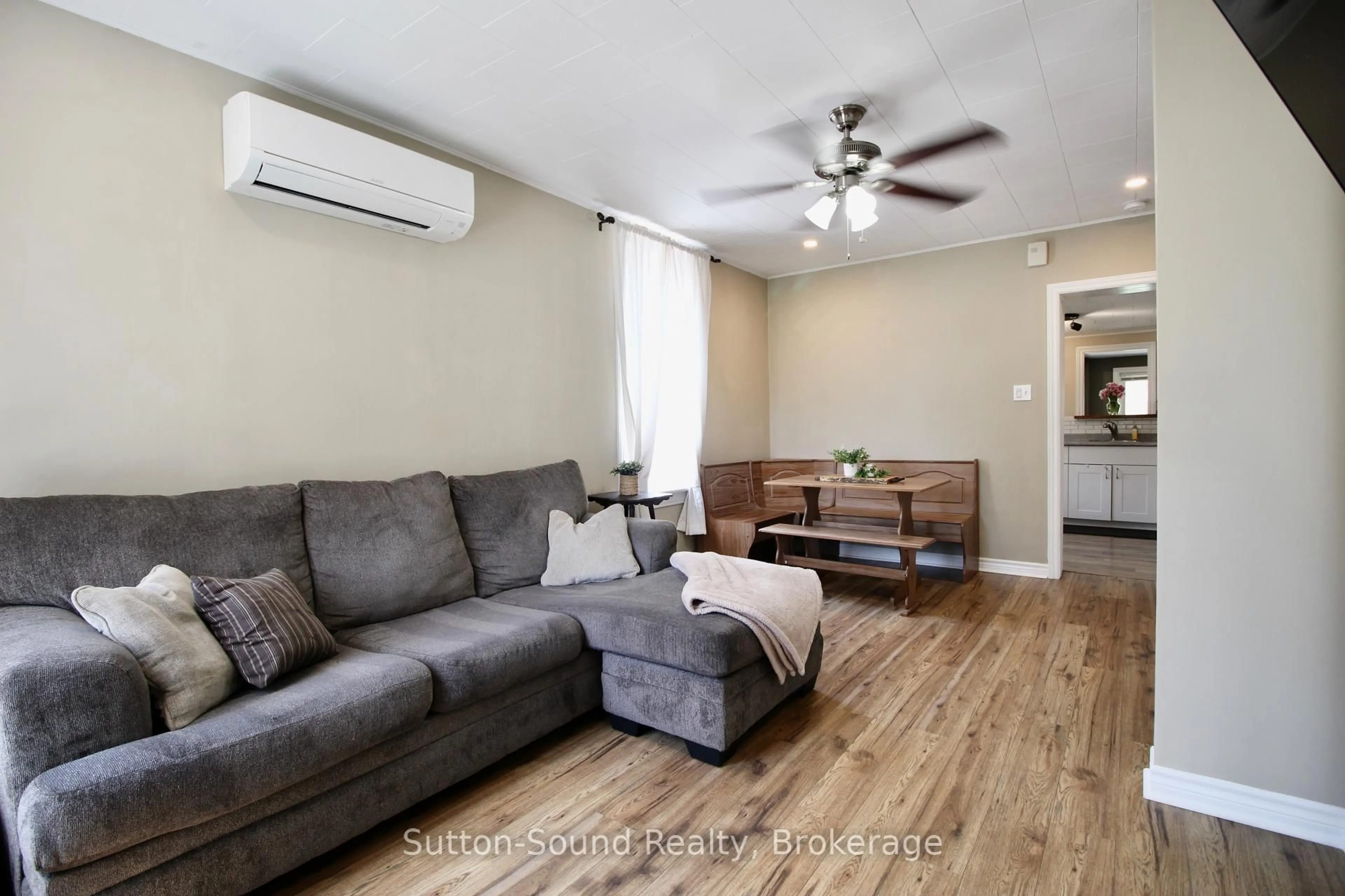 Living room with furniture, wood/laminate floor for 2168 6th Ave, Owen Sound Ontario N4K 5J3