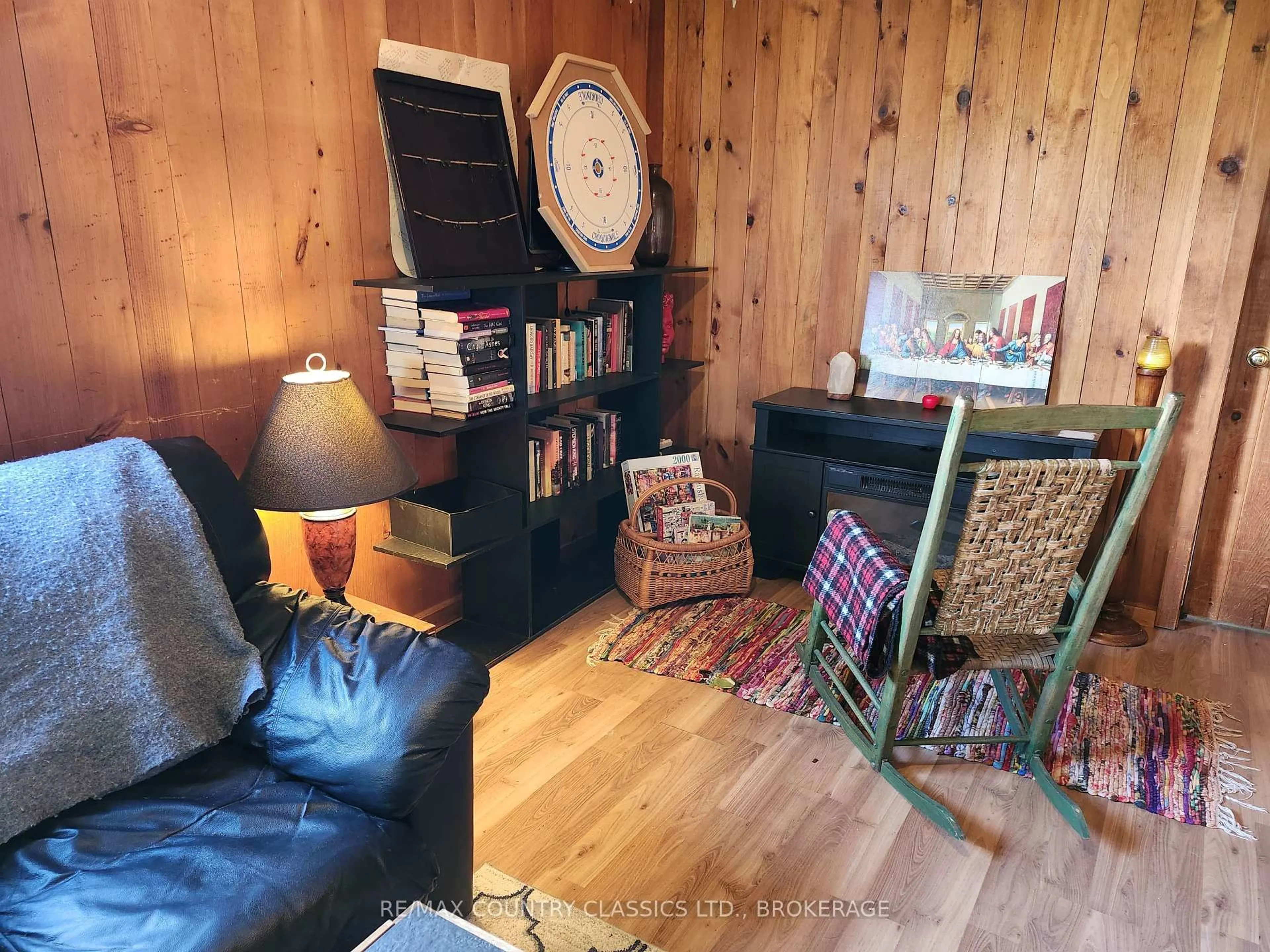 Living room with furniture, wood/laminate floor for 5853 Hwy 506 N/A, Cloyne Ontario K0H 1K0