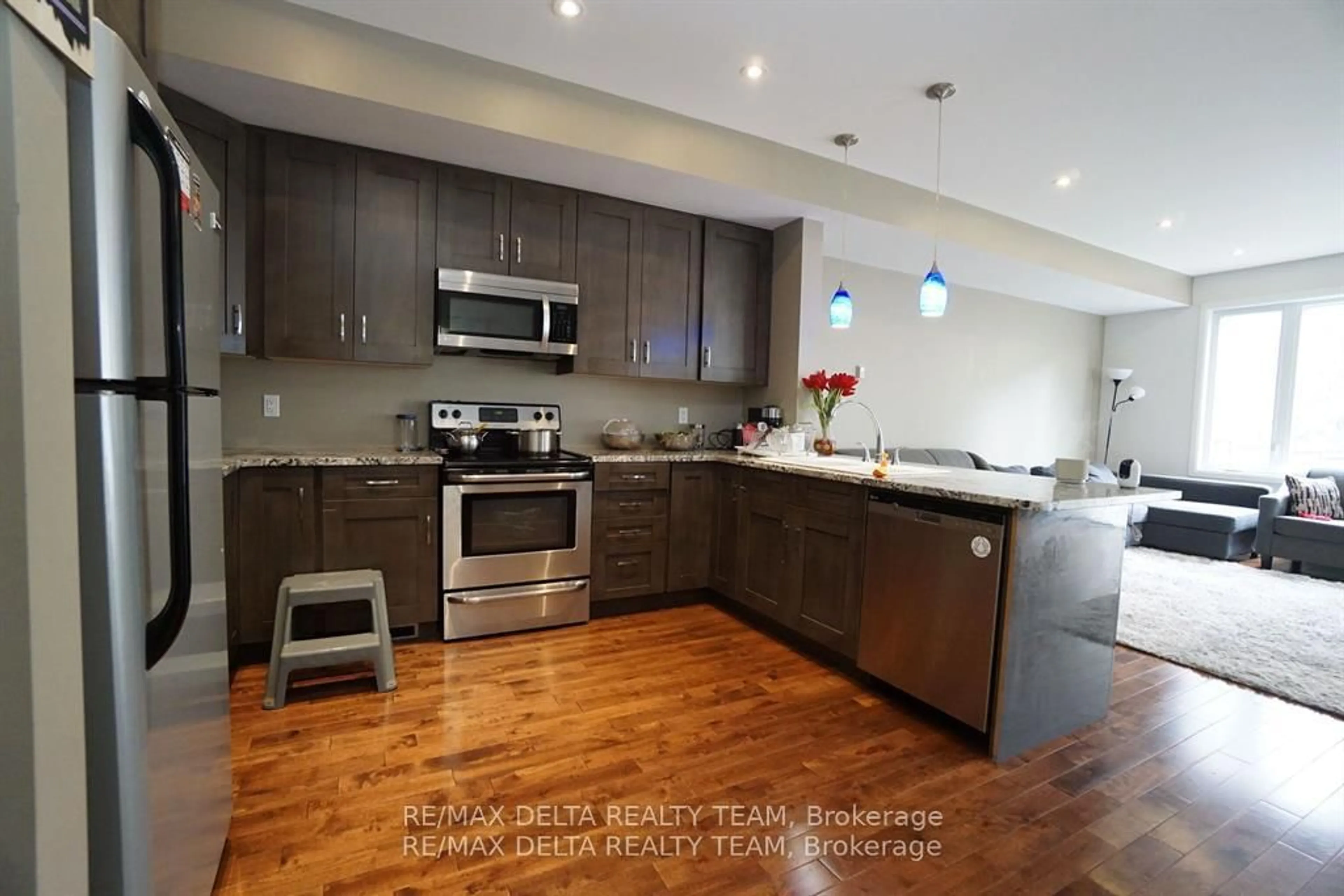 Open concept kitchen, wood/laminate floor for 498 Moodie Dr, Ottawa Ontario K2H 8A7