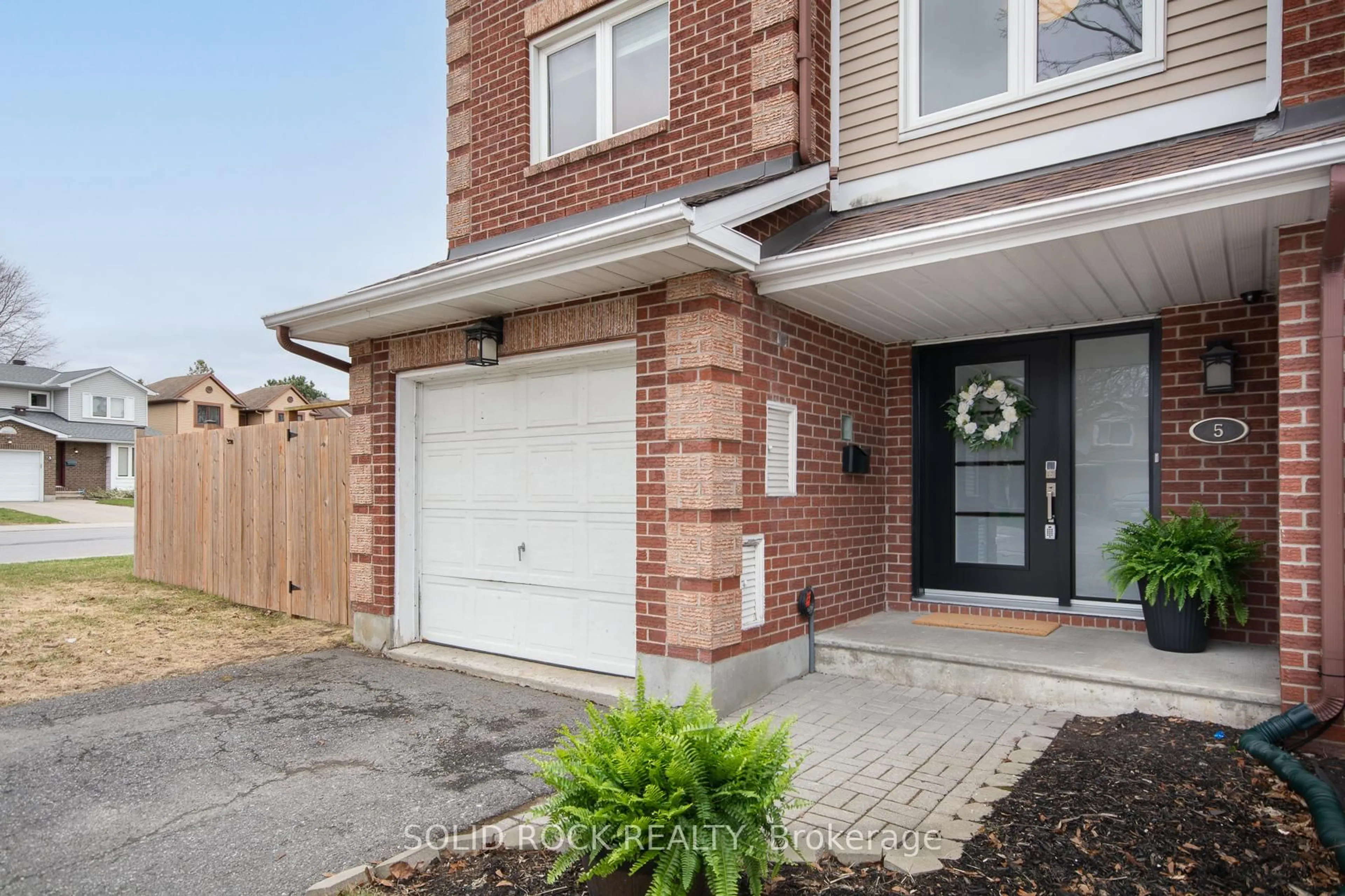 Home with brick exterior material, street for 5 Weybridge Dr, Ottawa Ontario K2J 4A1