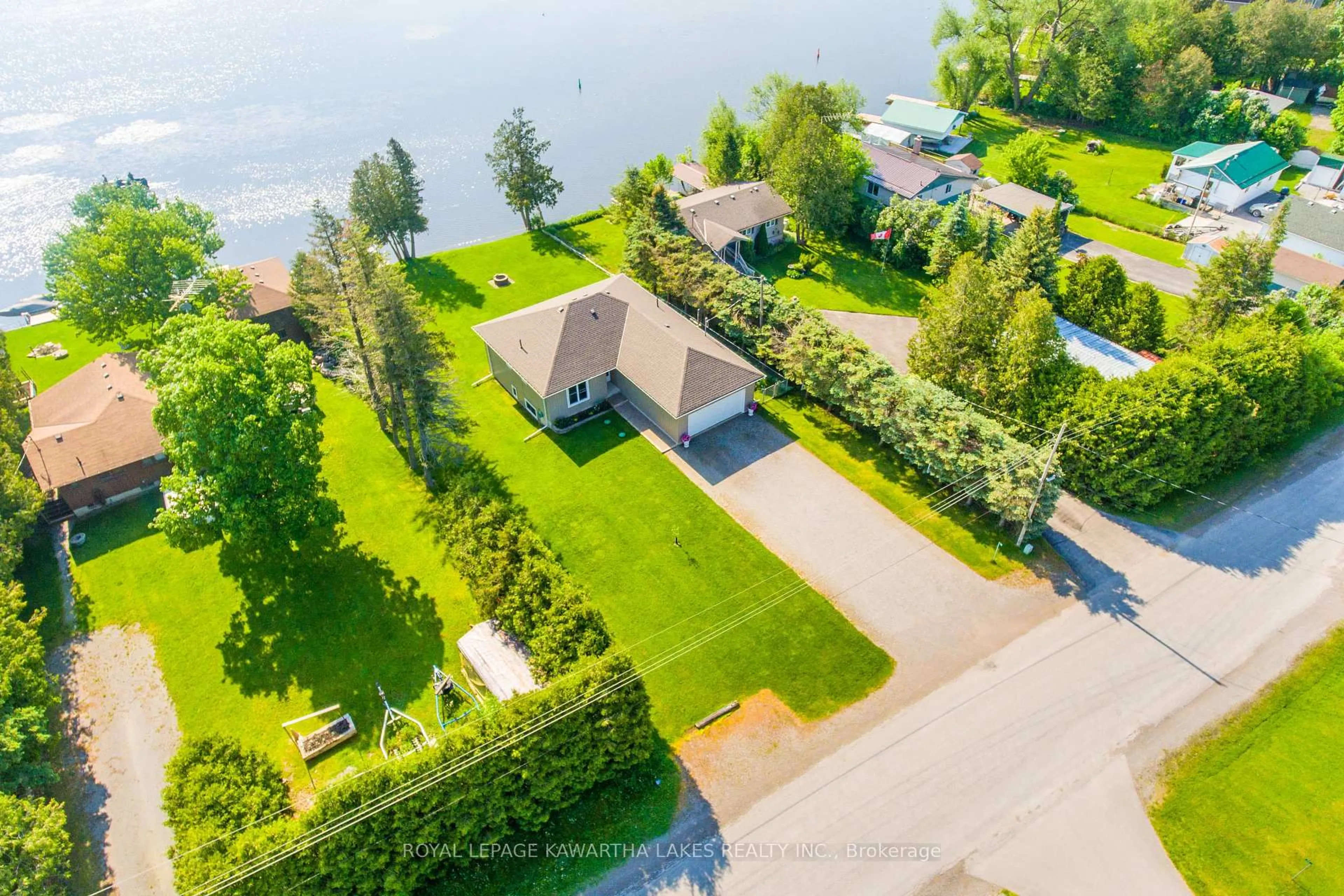A pic from outside/outdoor area/front of a property/back of a property/a pic from drone, water/lake/river/ocean view for 36 Riverside Dr, Kawartha Lakes Ontario K9V 4R2