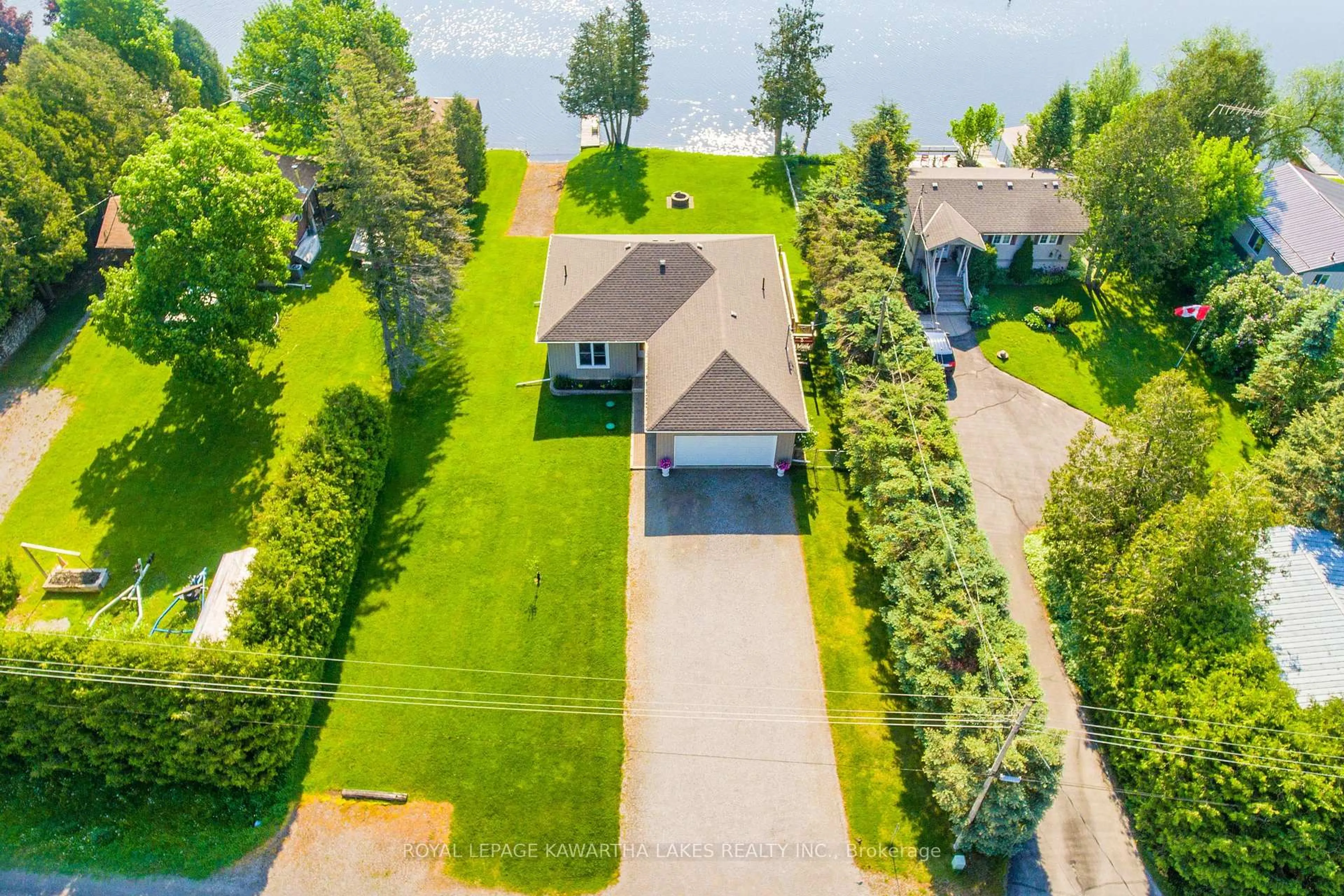 A pic from outside/outdoor area/front of a property/back of a property/a pic from drone, water/lake/river/ocean view for 36 Riverside Dr, Kawartha Lakes Ontario K9V 4R2
