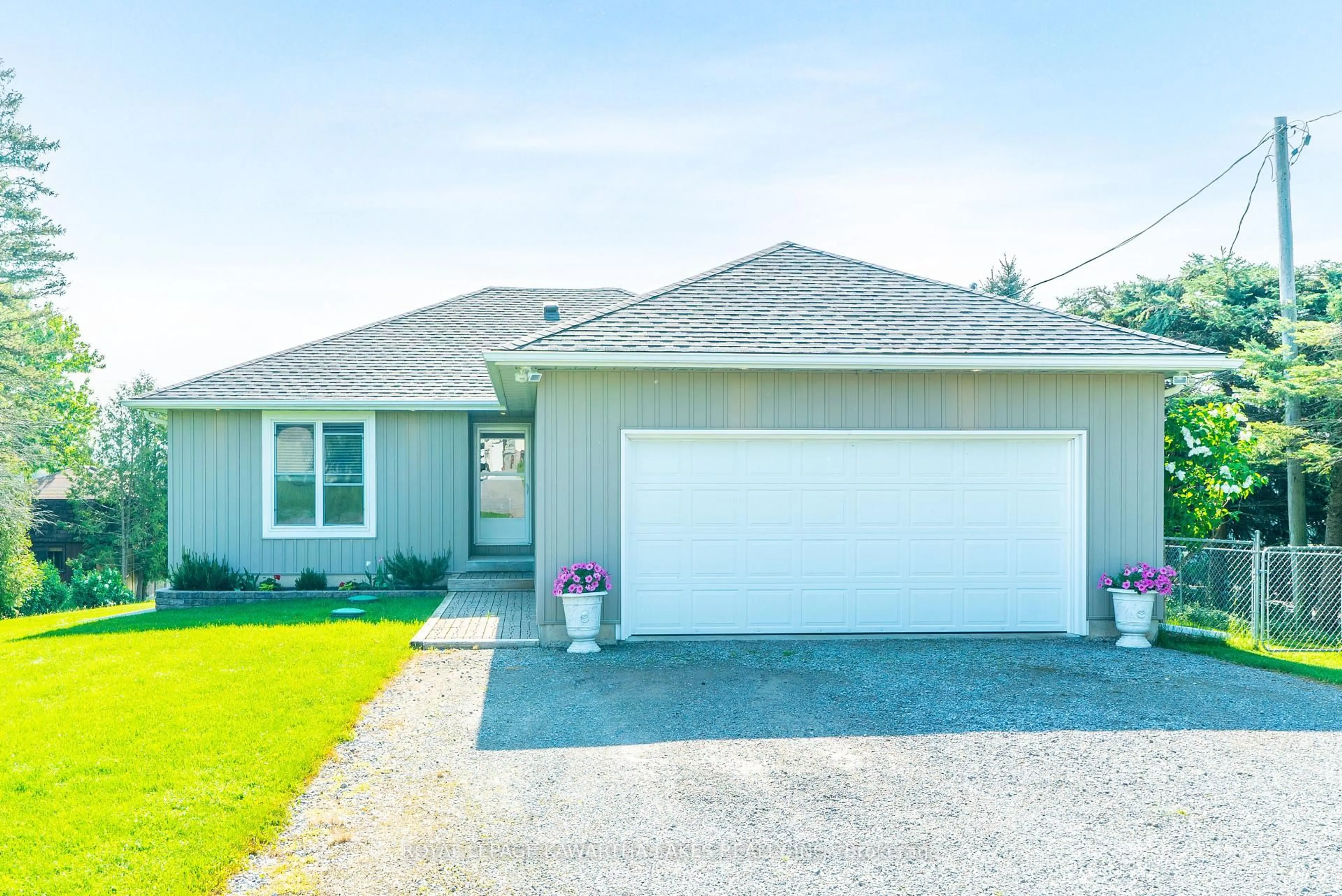 Home with vinyl exterior material, street for 36 Riverside Dr, Kawartha Lakes Ontario K9V 4R2