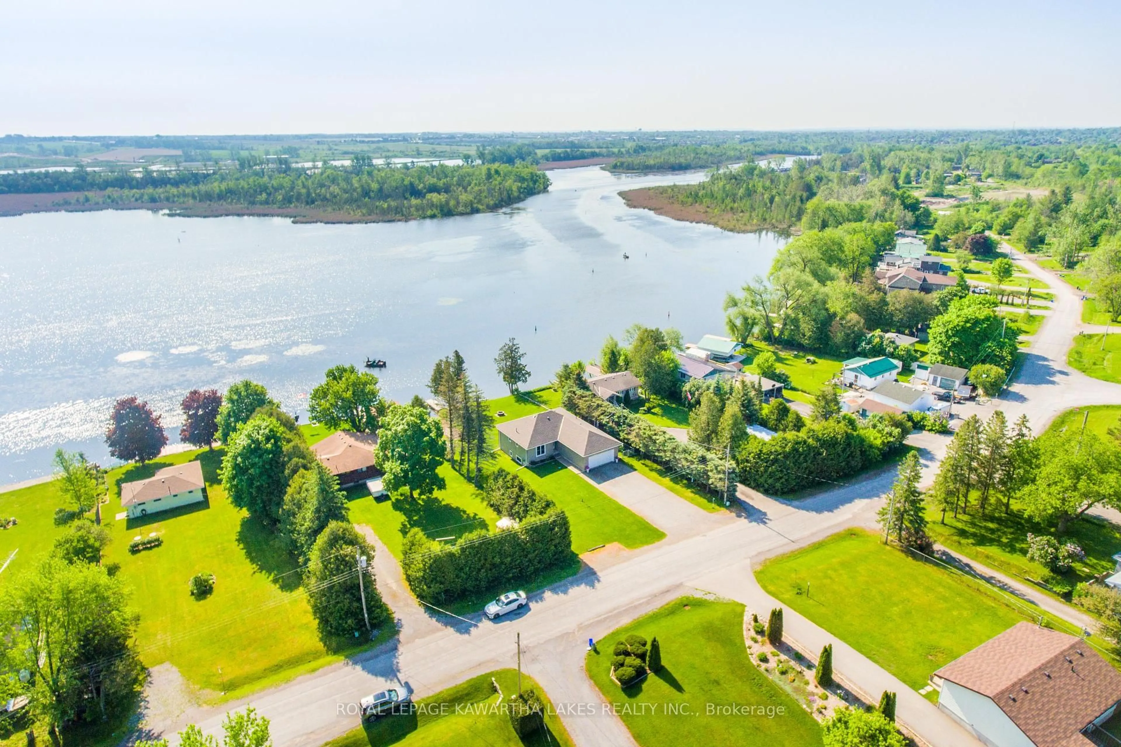 A pic from outside/outdoor area/front of a property/back of a property/a pic from drone, water/lake/river/ocean view for 36 Riverside Dr, Kawartha Lakes Ontario K9V 4R2