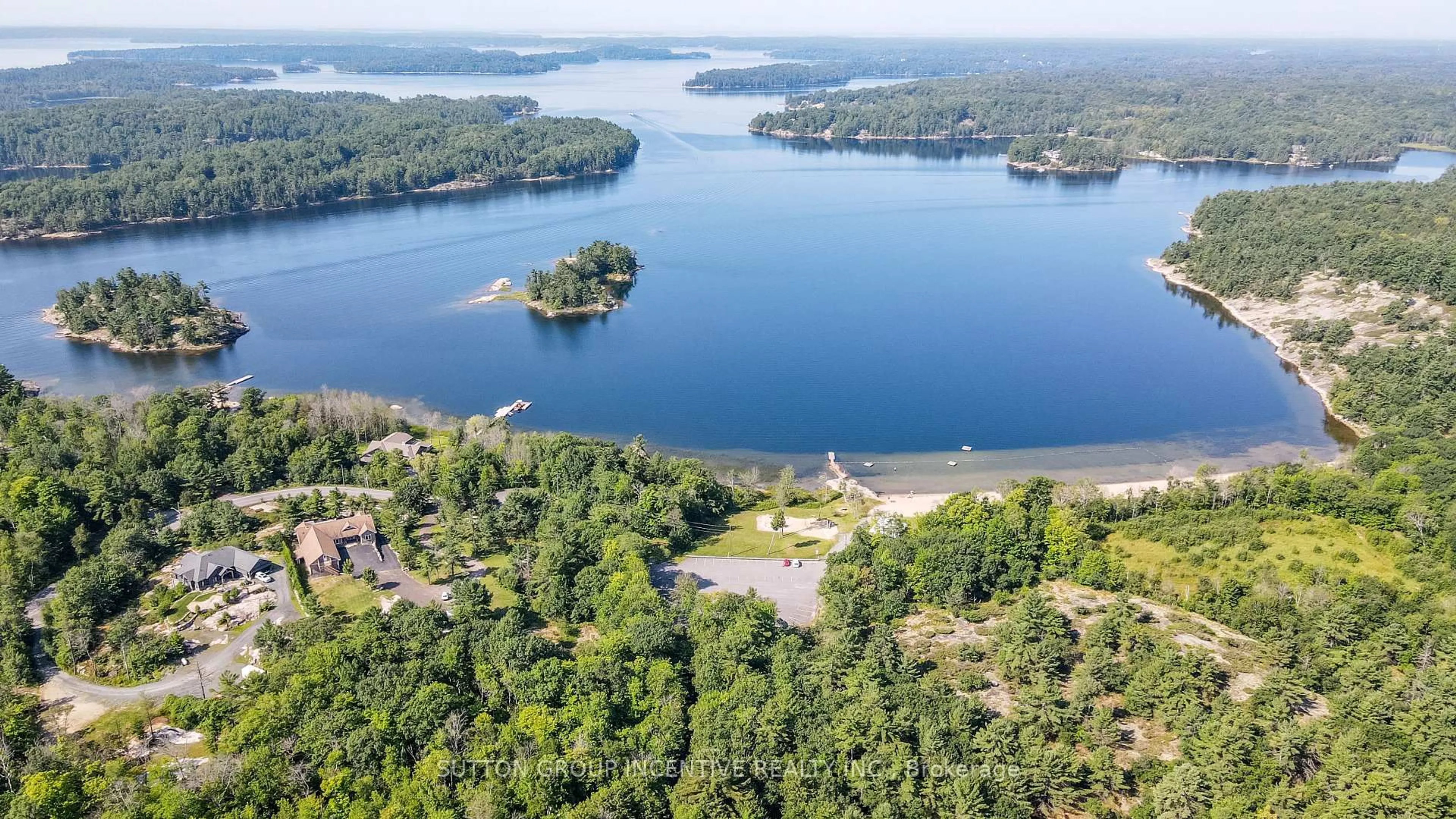 A pic from outside/outdoor area/front of a property/back of a property/a pic from drone, water/lake/river/ocean view for 65 Big Sound Rd #Legal second suite, McDougall Ontario P0G 1G0