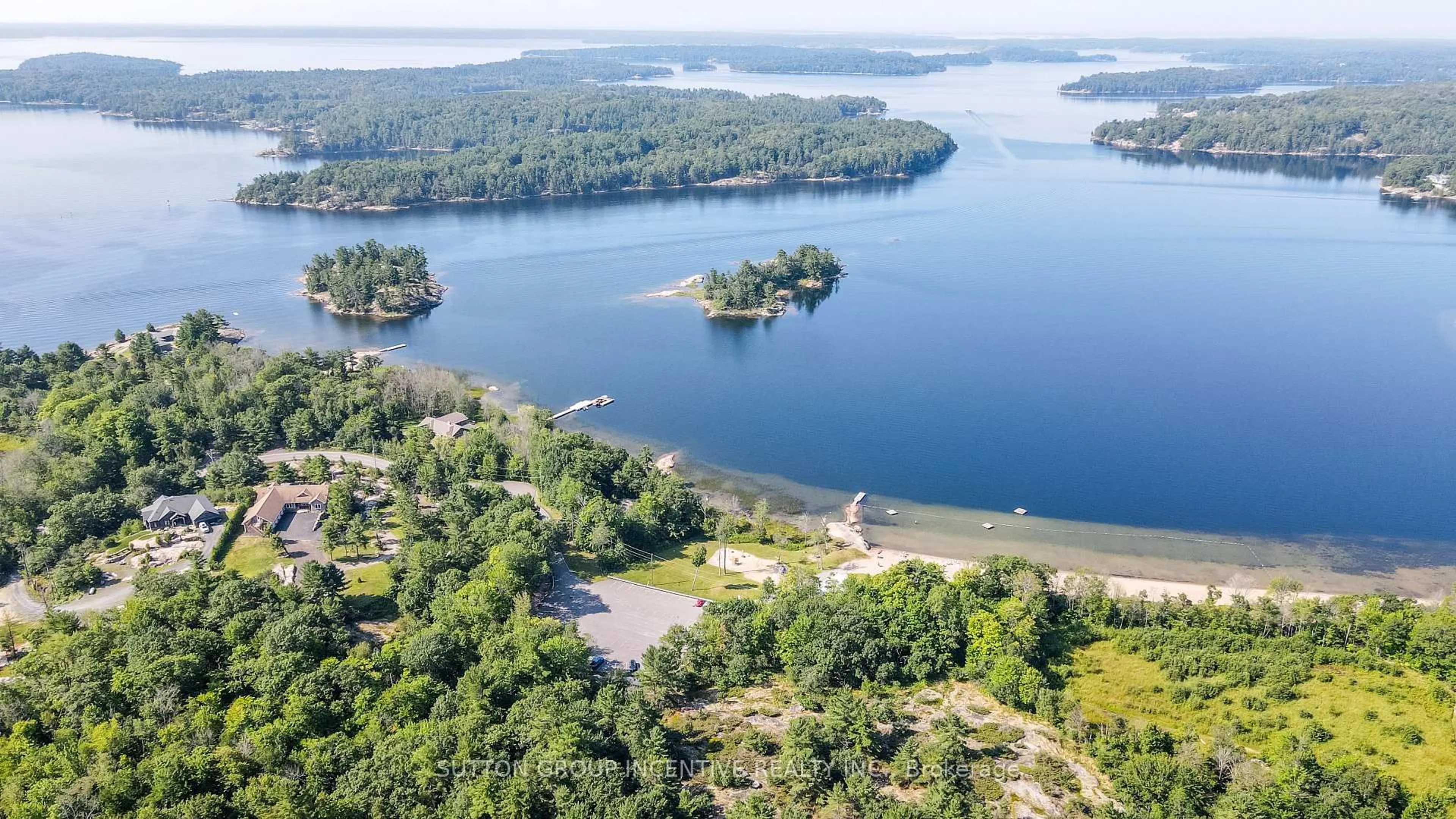 A pic from outside/outdoor area/front of a property/back of a property/a pic from drone, water/lake/river/ocean view for 65 Big Sound Rd #Legal second suite, McDougall Ontario P0G 1G0