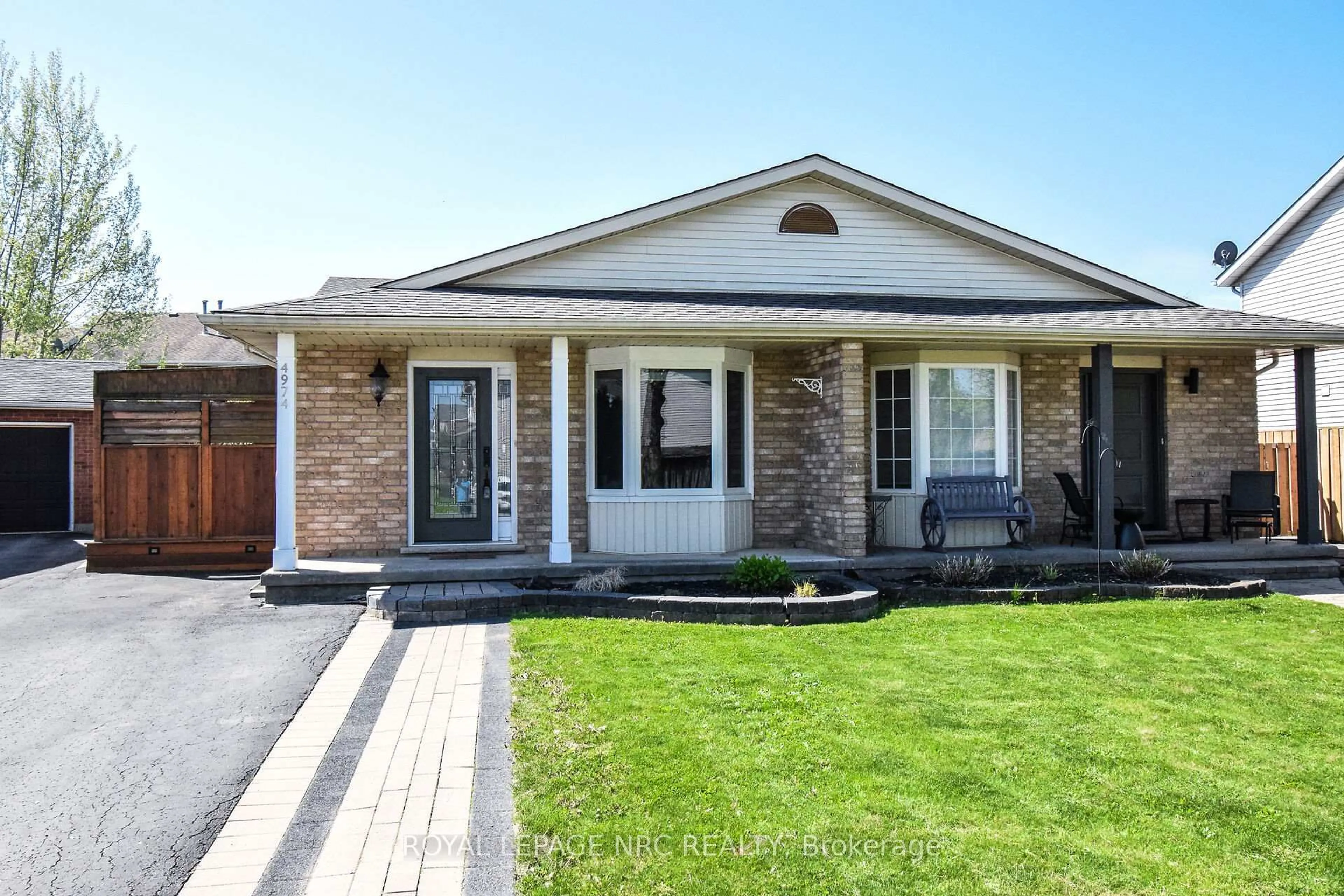 Home with brick exterior material, street for 4974 WINDGATE Dr, Niagara Falls Ontario L2H 2Z7