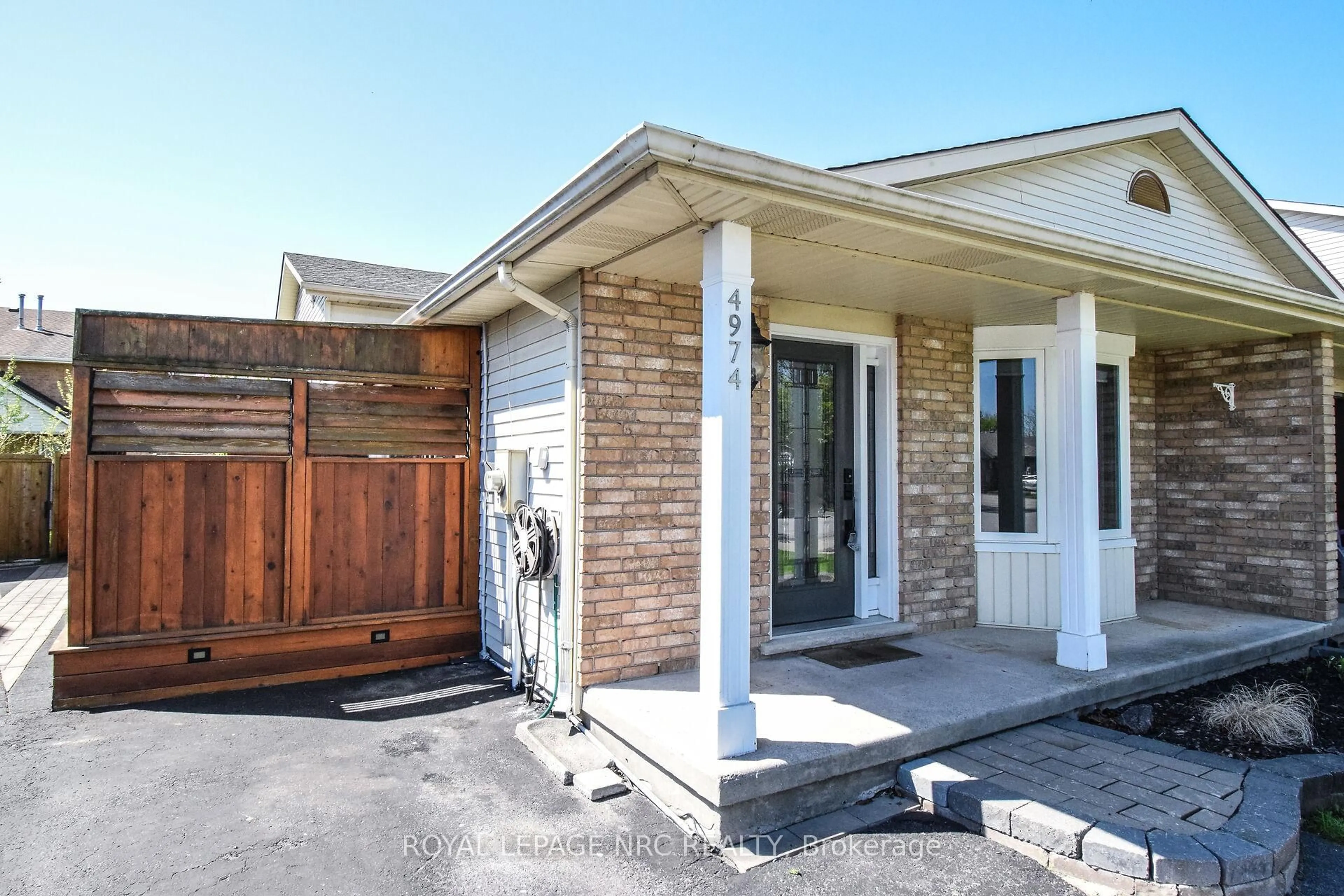 Home with brick exterior material, street for 4974 WINDGATE Dr, Niagara Falls Ontario L2H 2Z7
