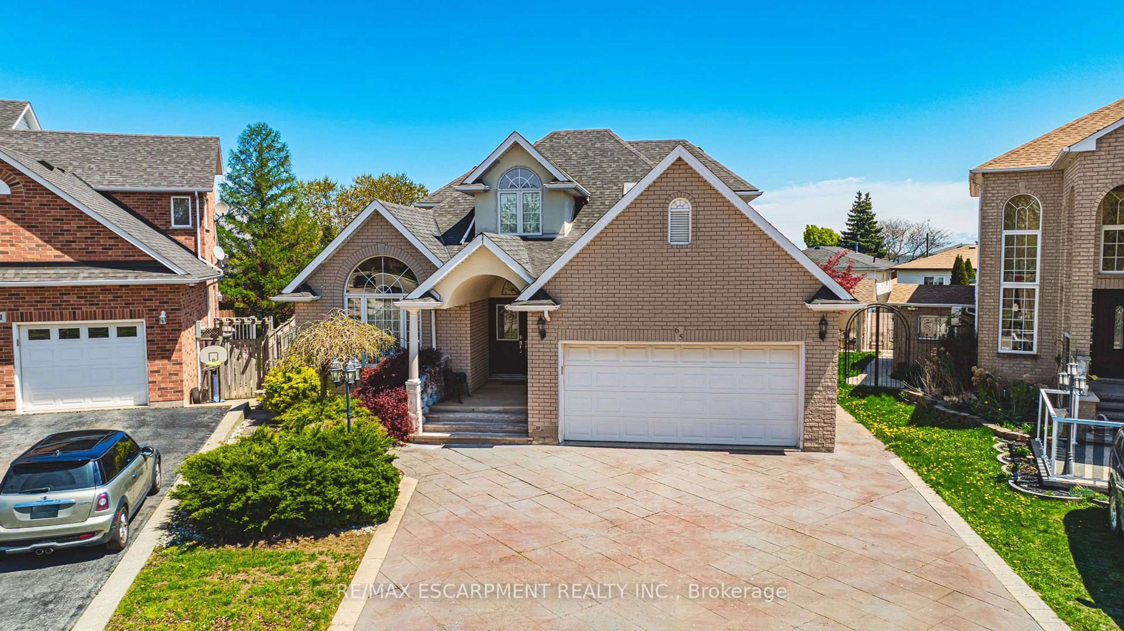 Home with brick exterior material, street for 65 Mount Pleasant Dr, Hamilton Ontario L8W 3H3
