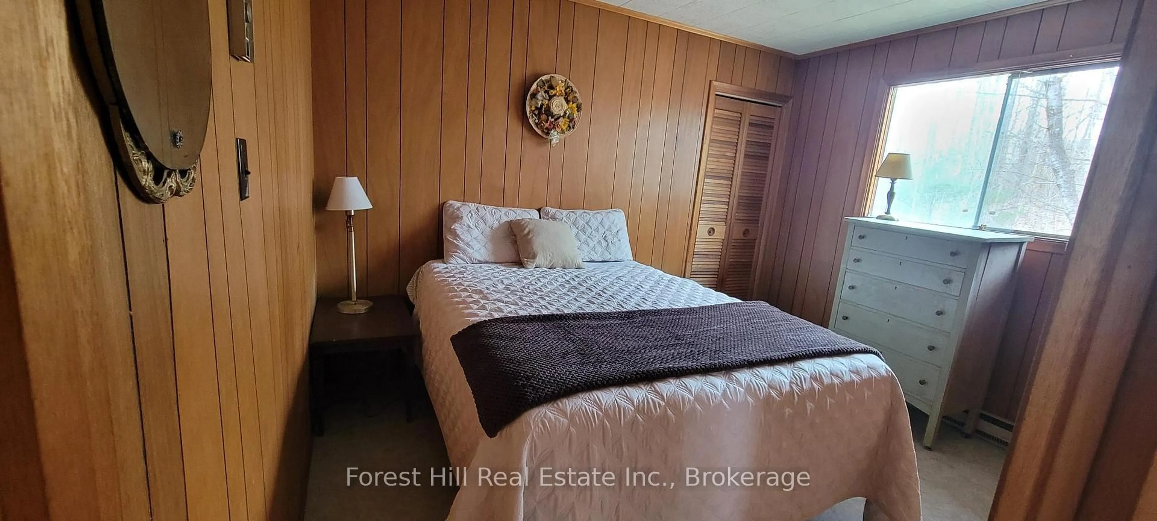 Bedroom with bed, wood/laminate floor for 4534 Southwood Rd ##5, Muskoka Lakes Ontario P0C 1M0