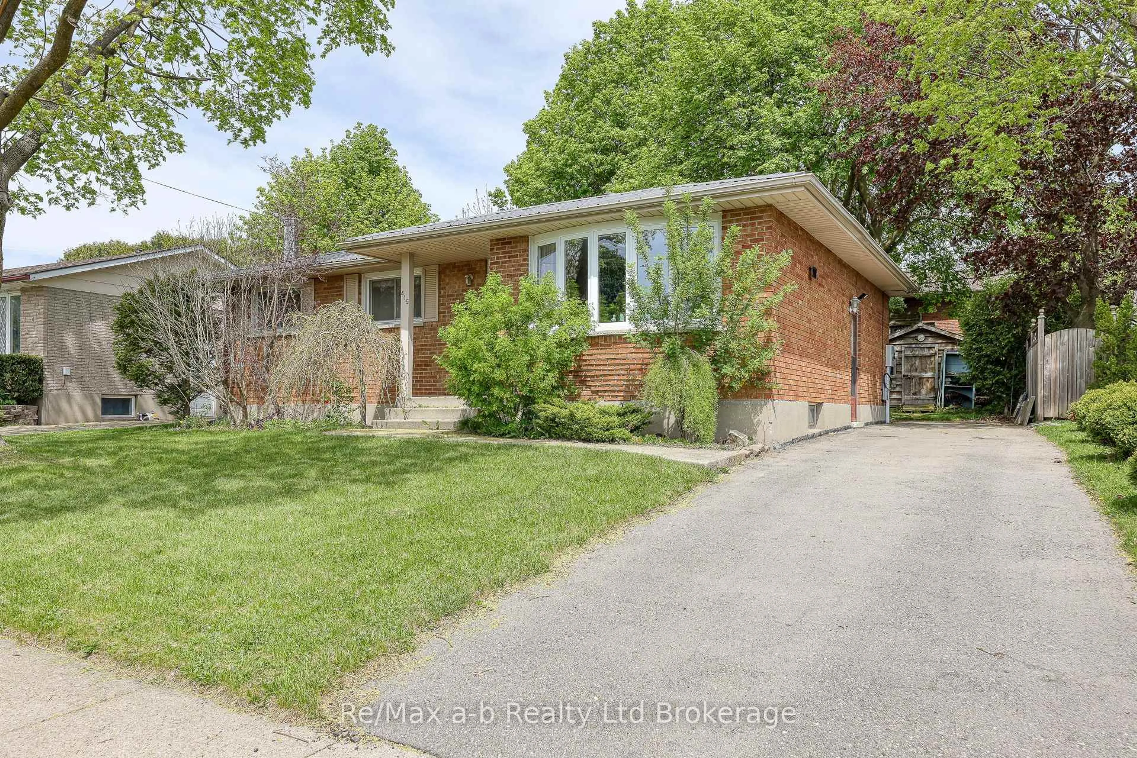 Home with brick exterior material, street for 415 Lampman Pl, Woodstock Ontario N4S 3S9