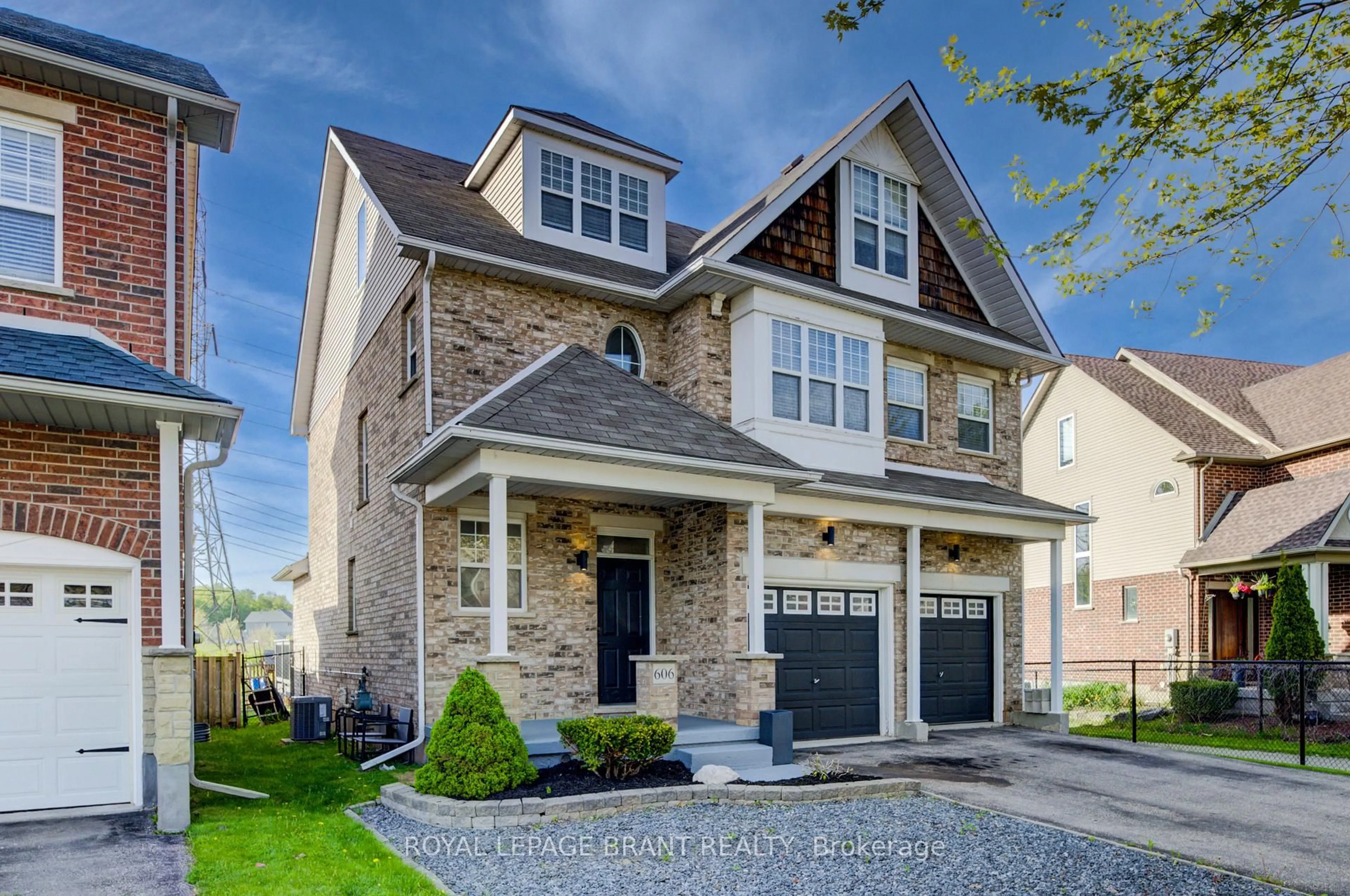 Home with brick exterior material, street for 606 Frieburg Dr, Waterloo Ontario N2T 2Y4