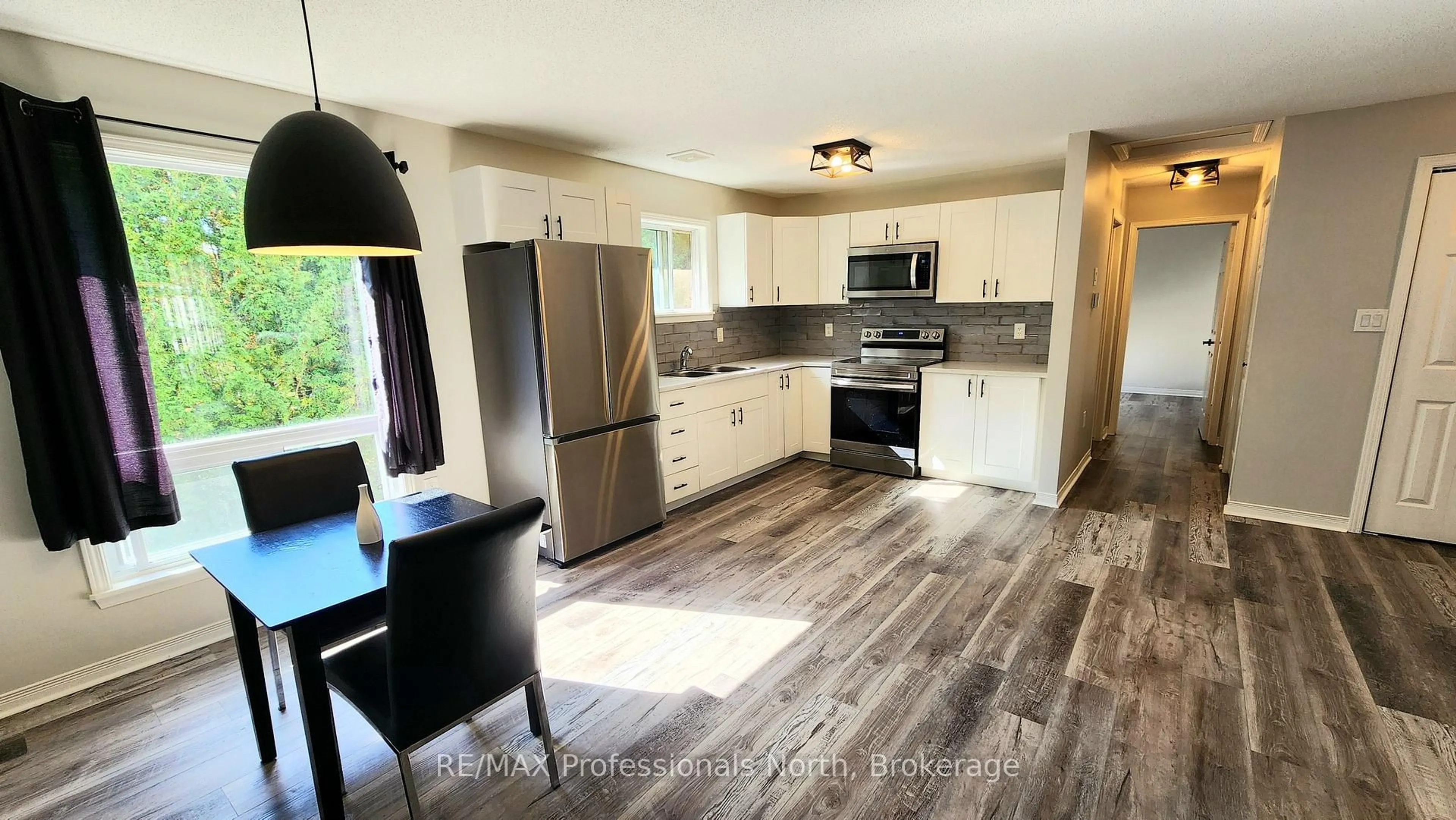 Open concept kitchen, wood/laminate floor for 200 Pine St #33, Bracebridge Ontario P1L 2H9