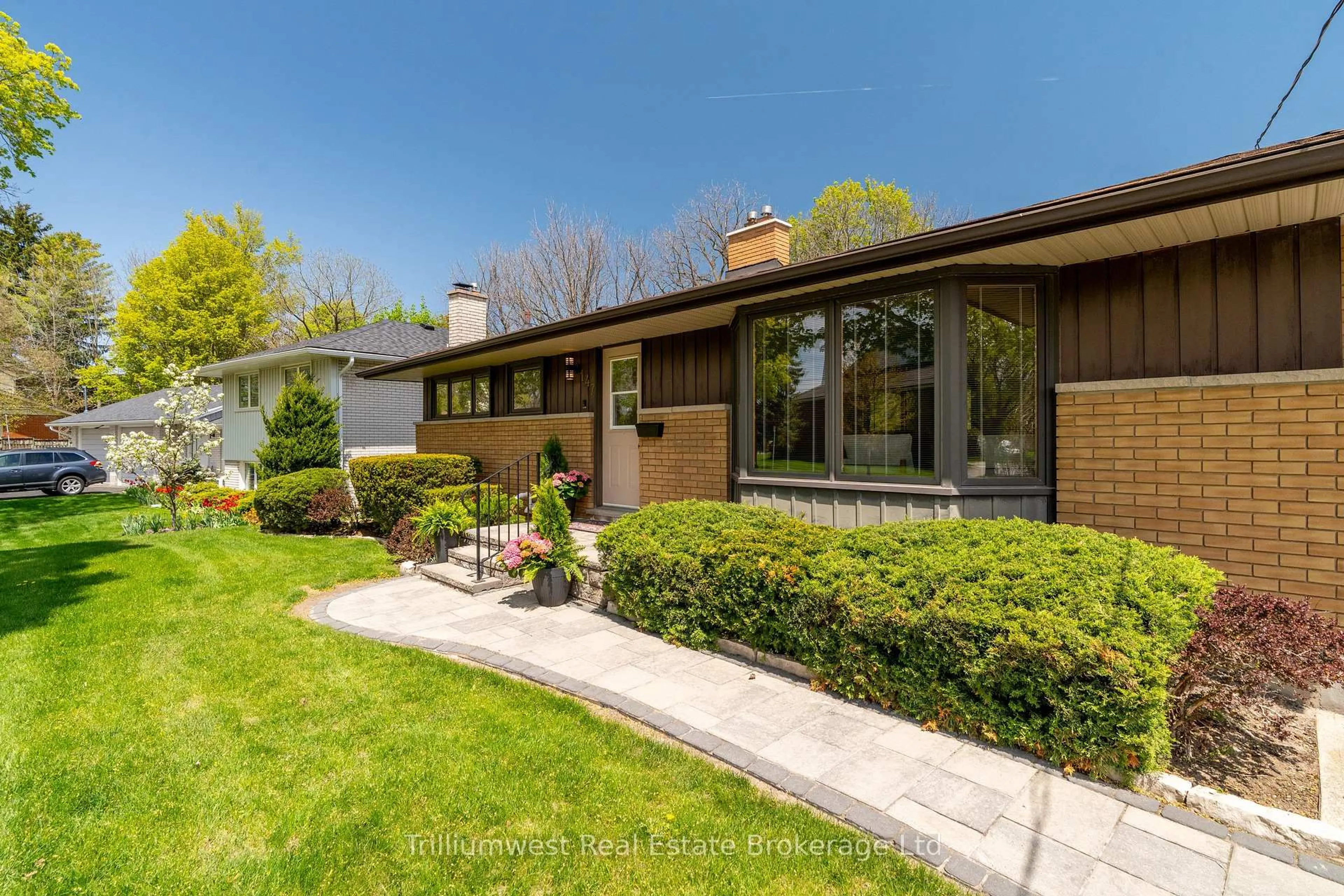 Home with brick exterior material, street for 147 Village Rd, Kitchener Ontario N2M 4K9