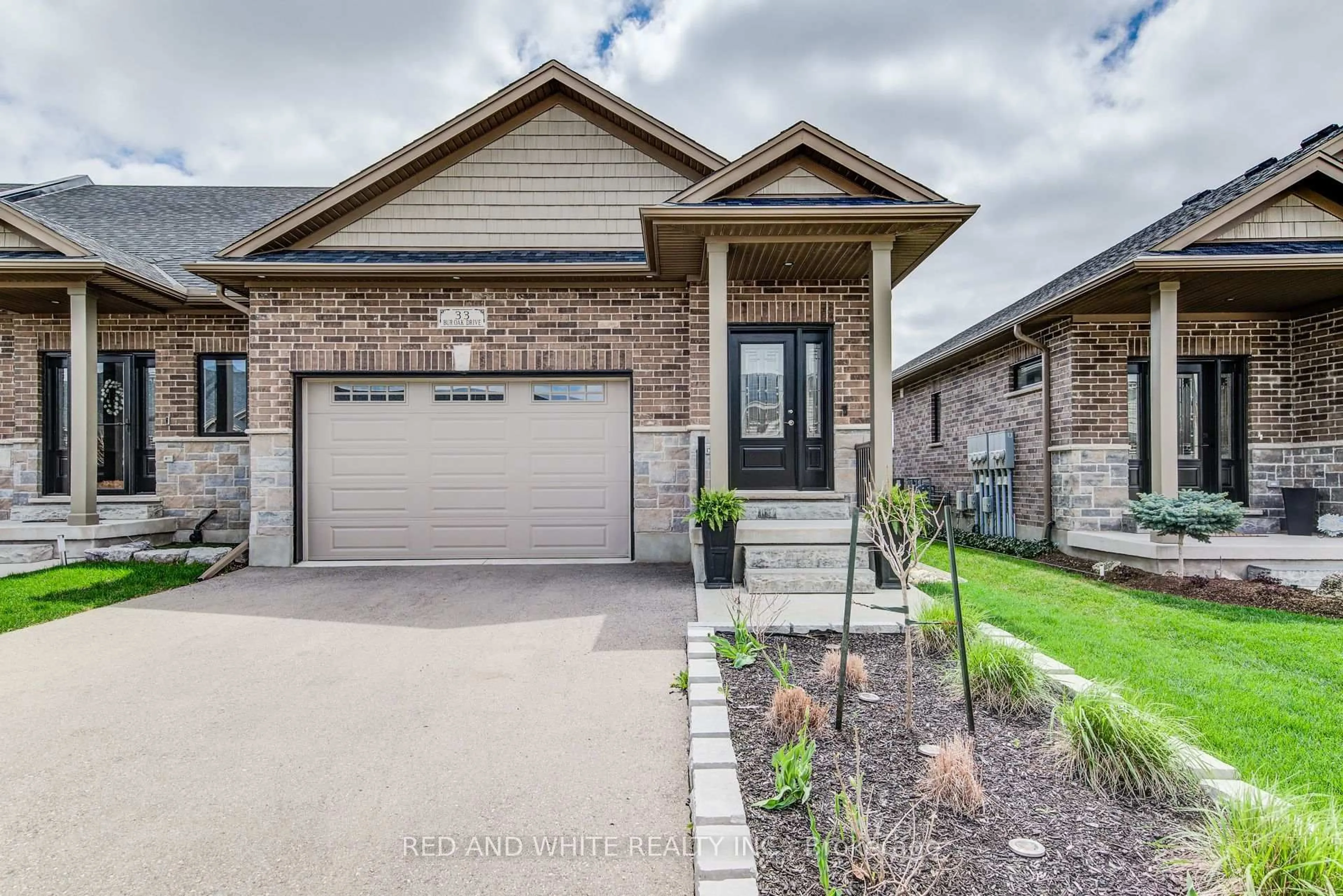 Home with brick exterior material, street for 33 Bur Oak Dr, Woolwich Ontario N3B 0C6