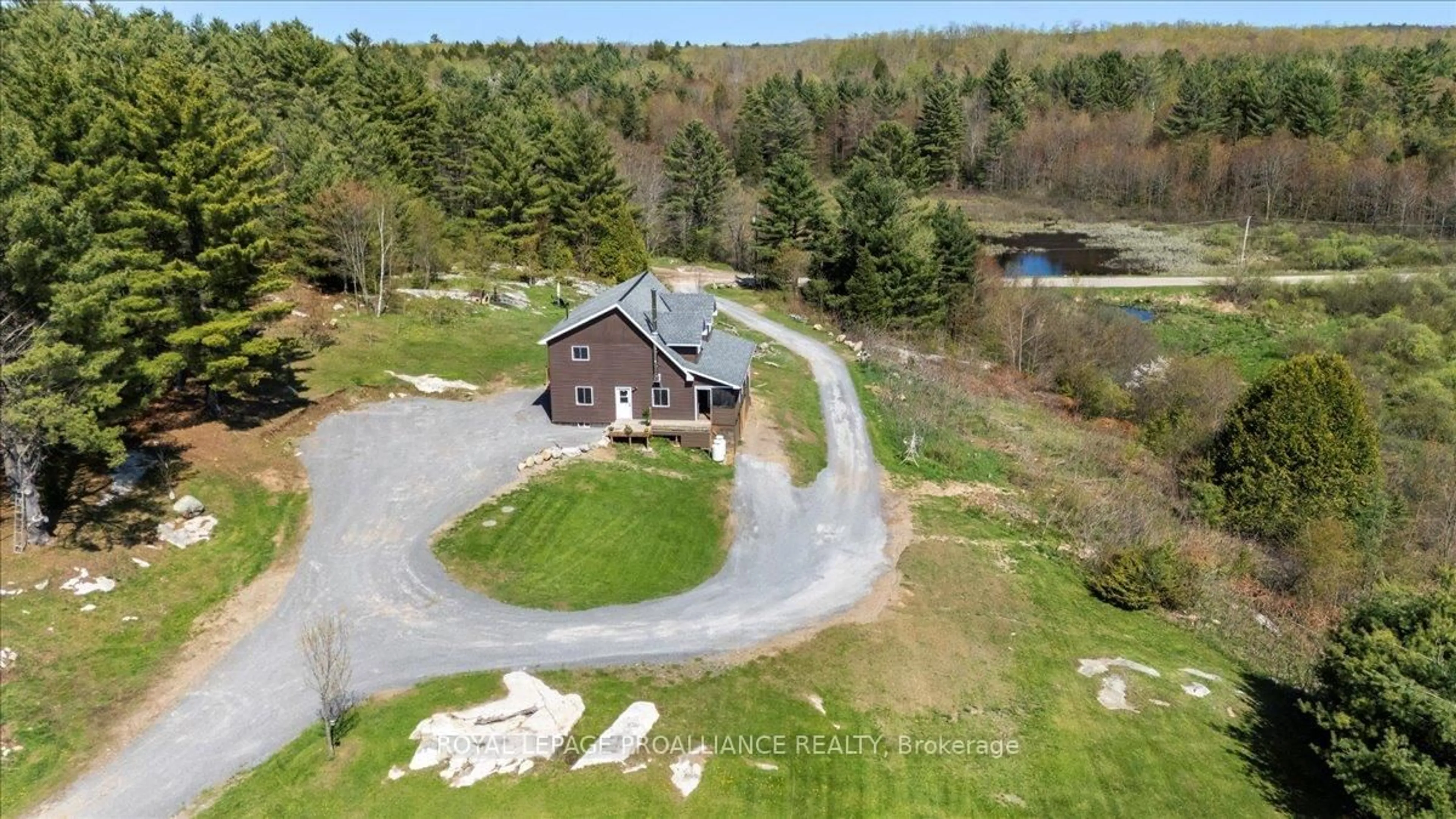 A pic from outside/outdoor area/front of a property/back of a property/a pic from drone, water/lake/river/ocean view for 340 Deer Rock Lake Rd, Kaladar Ontario K0H 1P0