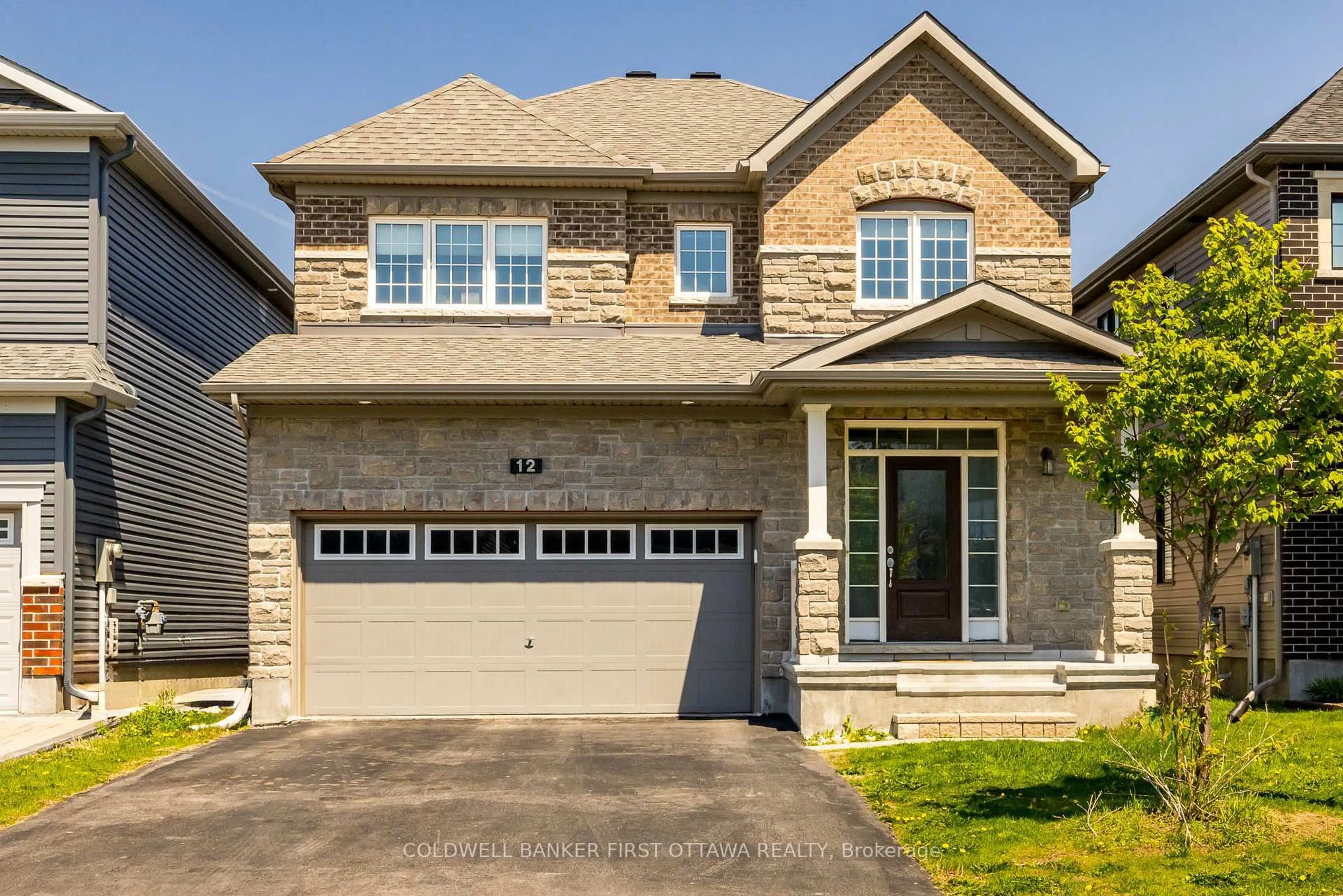 Home with brick exterior material, street for 12 HAWKS LANDING Cres, Stittsville Ontario K2S 1W1