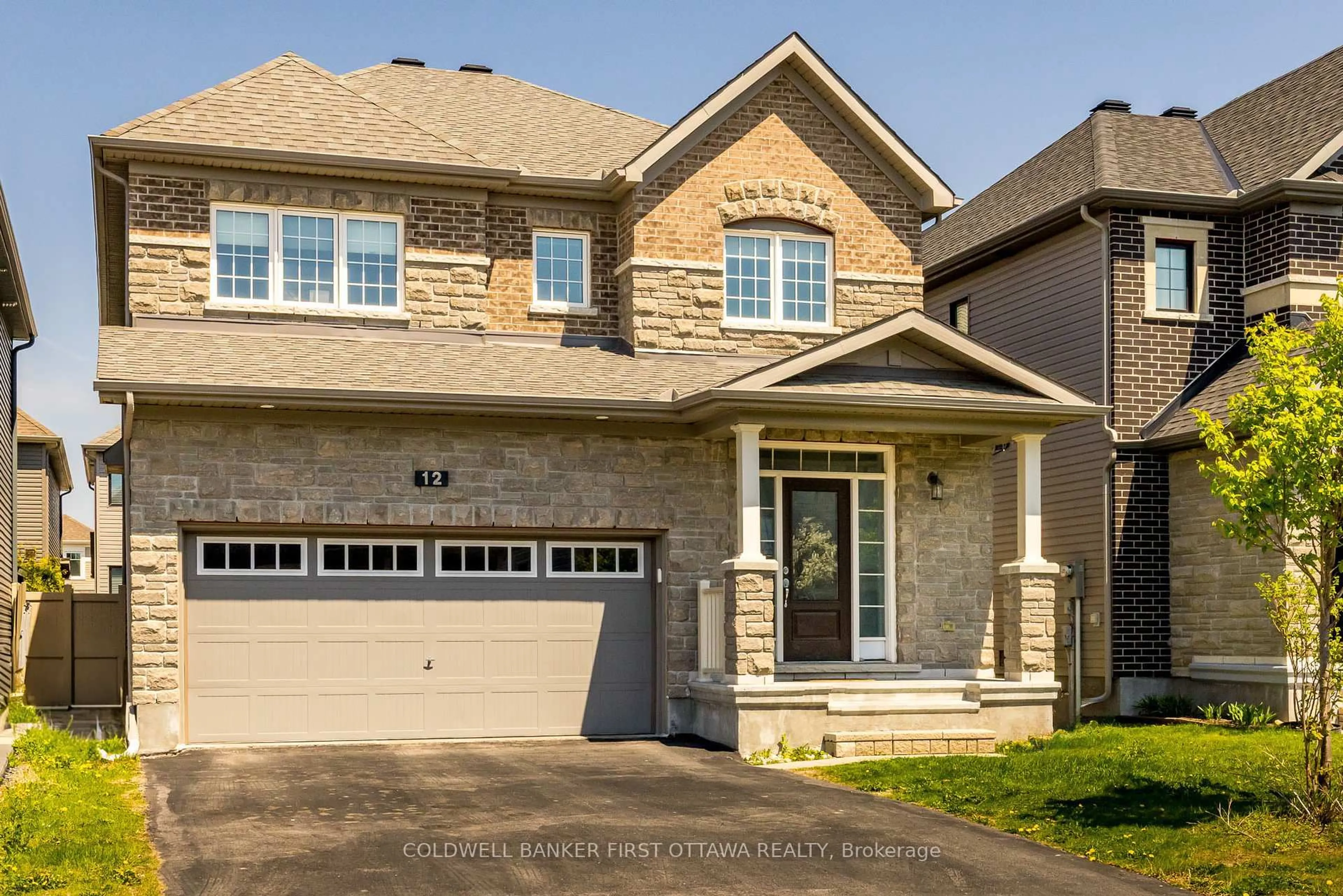 Home with brick exterior material, street for 12 HAWKS LANDING Cres, Stittsville Ontario K2S 1W1