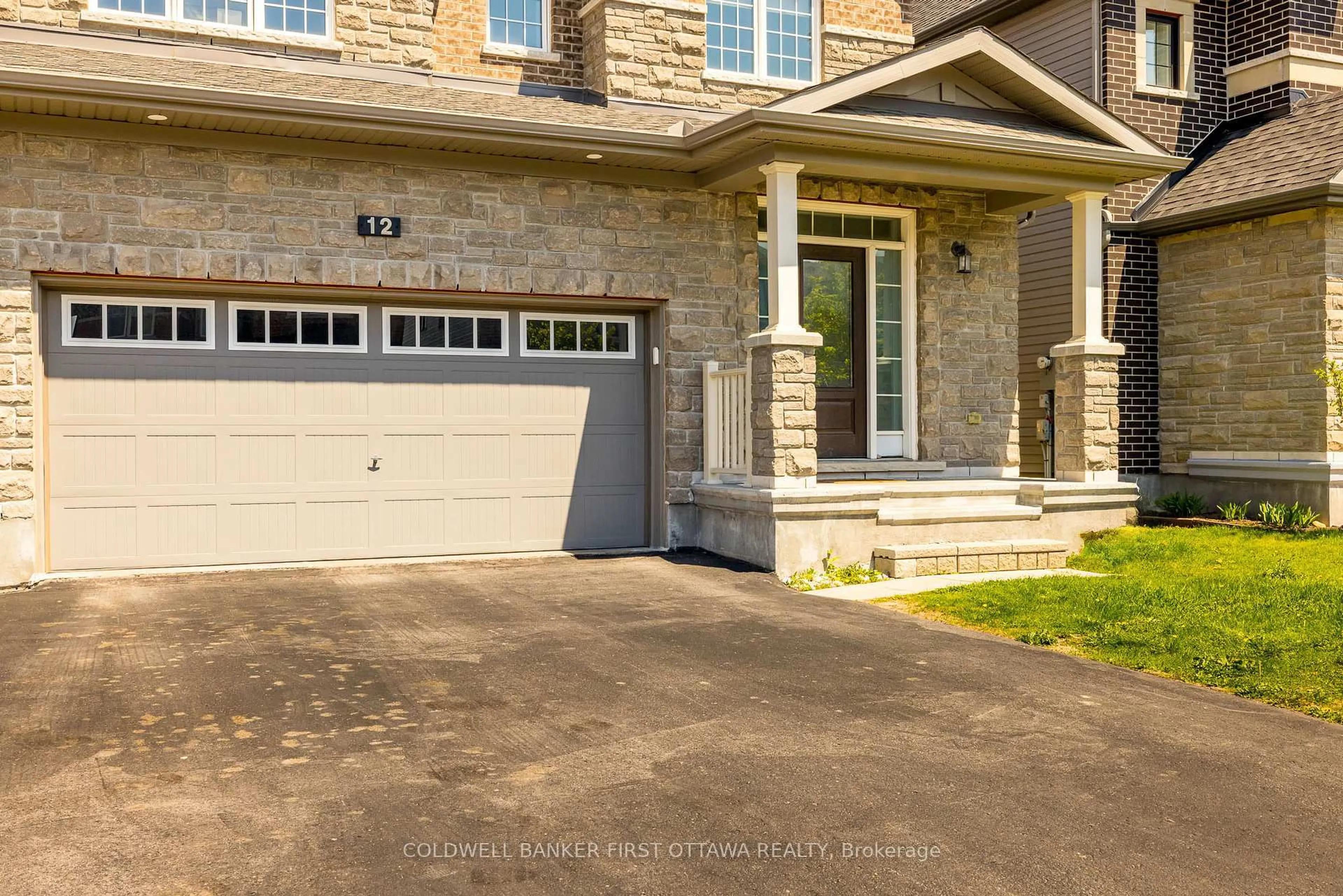Home with brick exterior material, street for 12 HAWKS LANDING Cres, Stittsville Ontario K2S 1W1