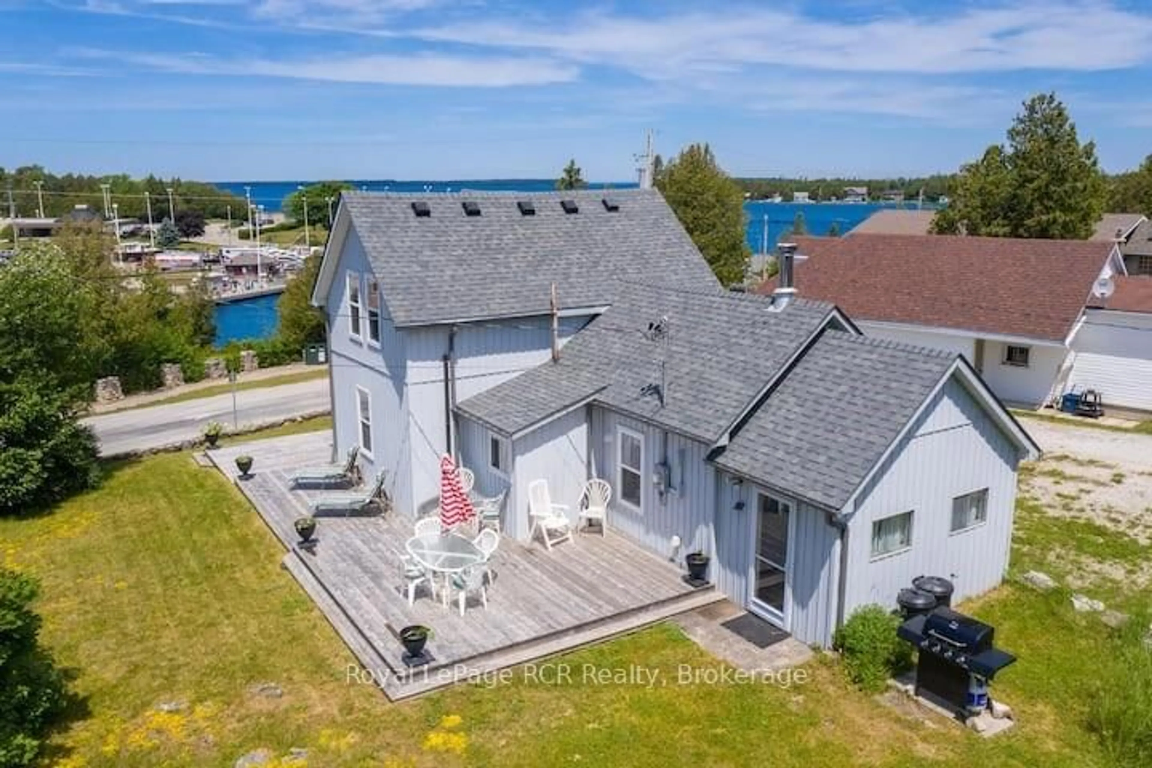 A pic from outside/outdoor area/front of a property/back of a property/a pic from drone, water/lake/river/ocean view for 42 Bay St, Northern Bruce Peninsula Ontario N0H 2R0