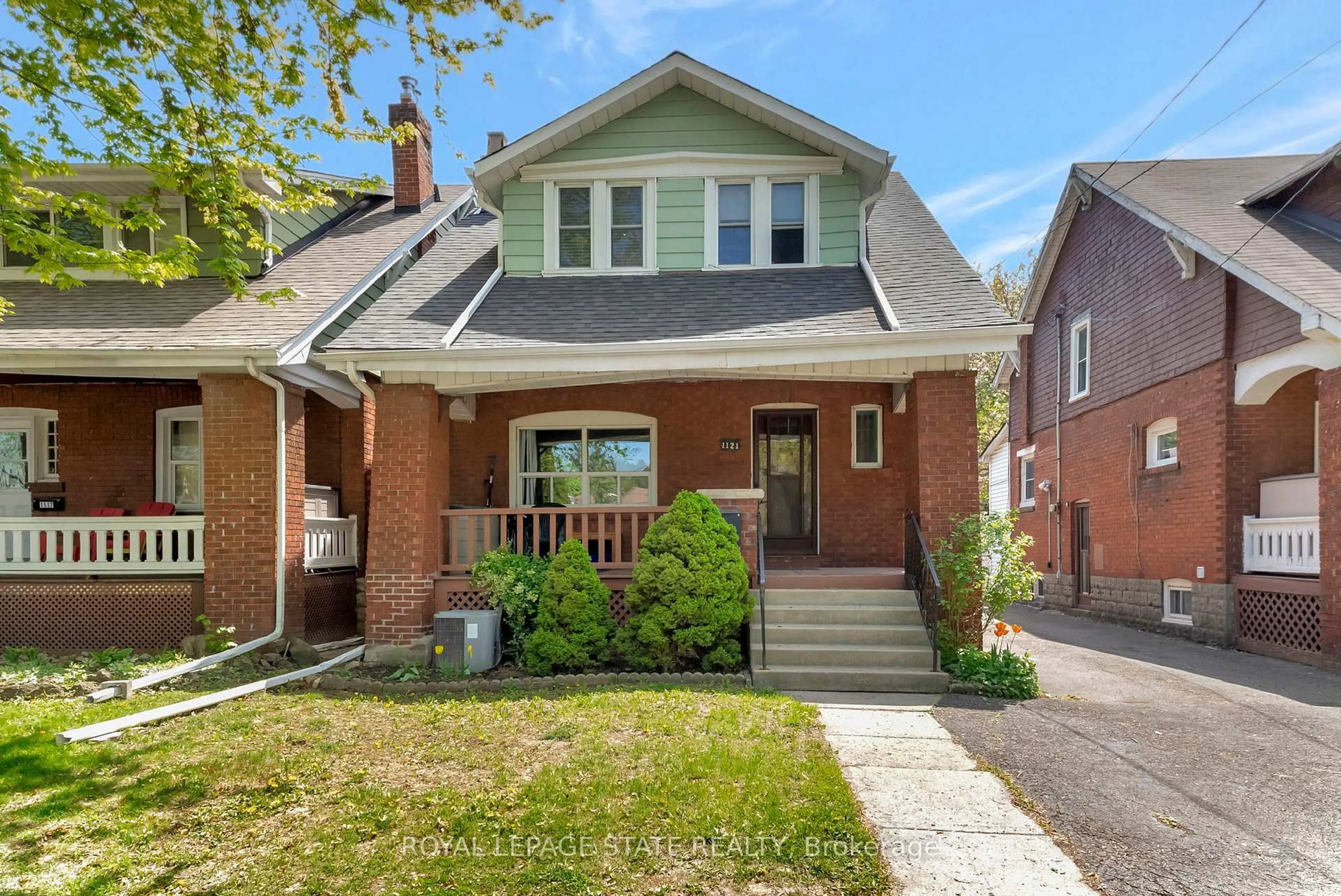 Home with brick exterior material, street for 1121 King St, Hamilton Ontario L8S 1L8