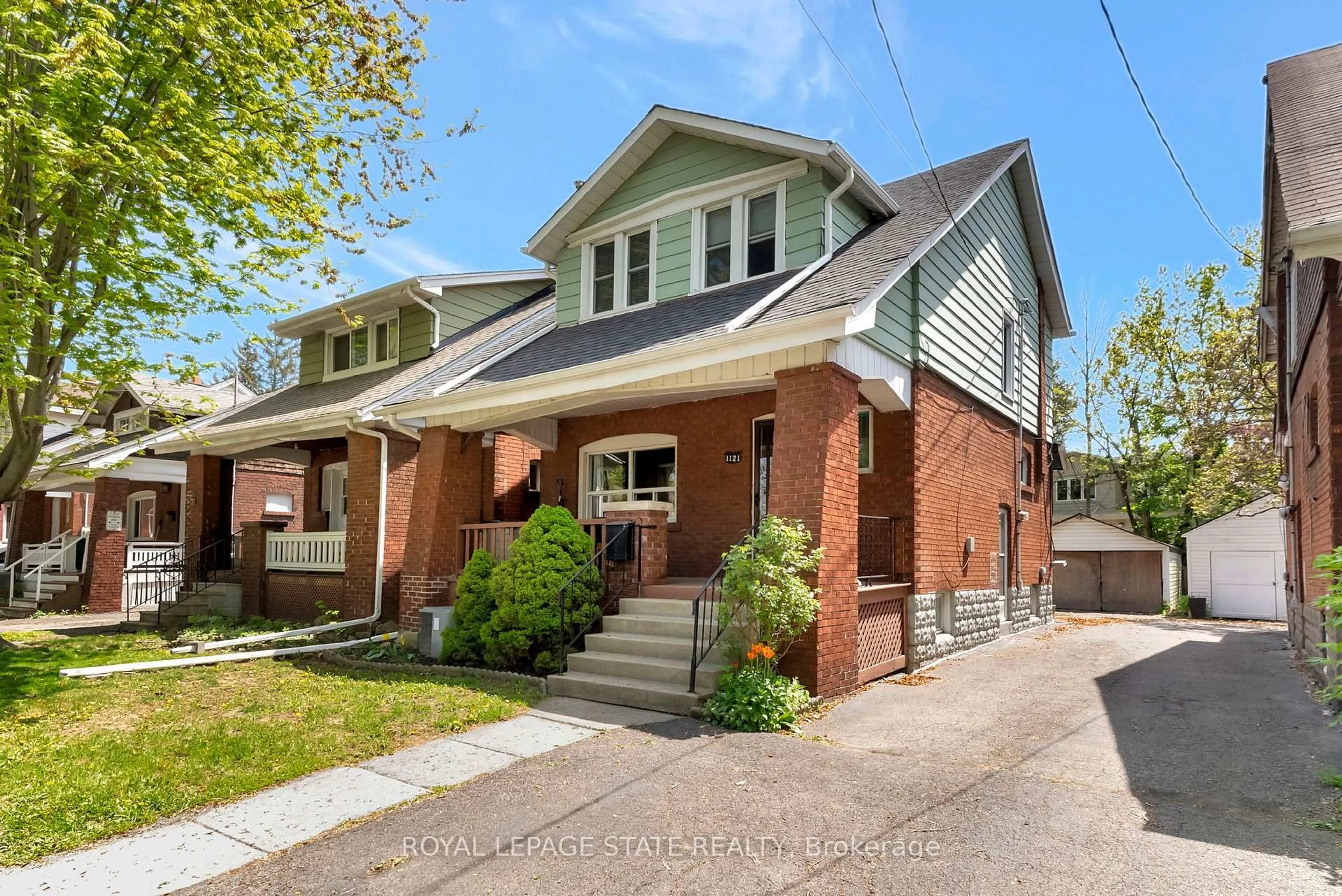 Home with brick exterior material, street for 1121 King St, Hamilton Ontario L8S 1L8