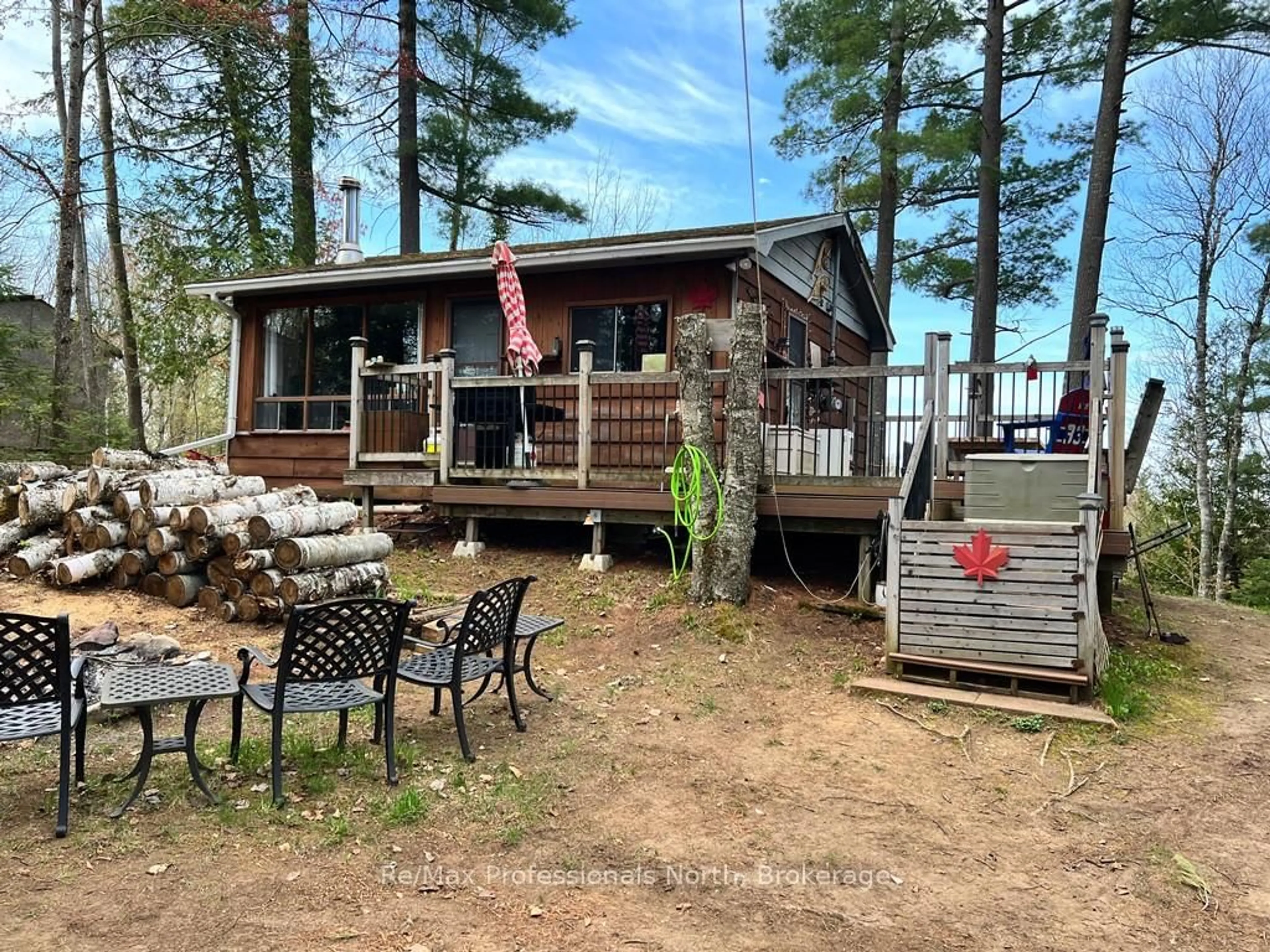 A pic from outside/outdoor area/front of a property/back of a property/a pic from drone, water/lake/river/ocean view for 1411 Clement Lake Rd, Highlands East Ontario K0L 3C0